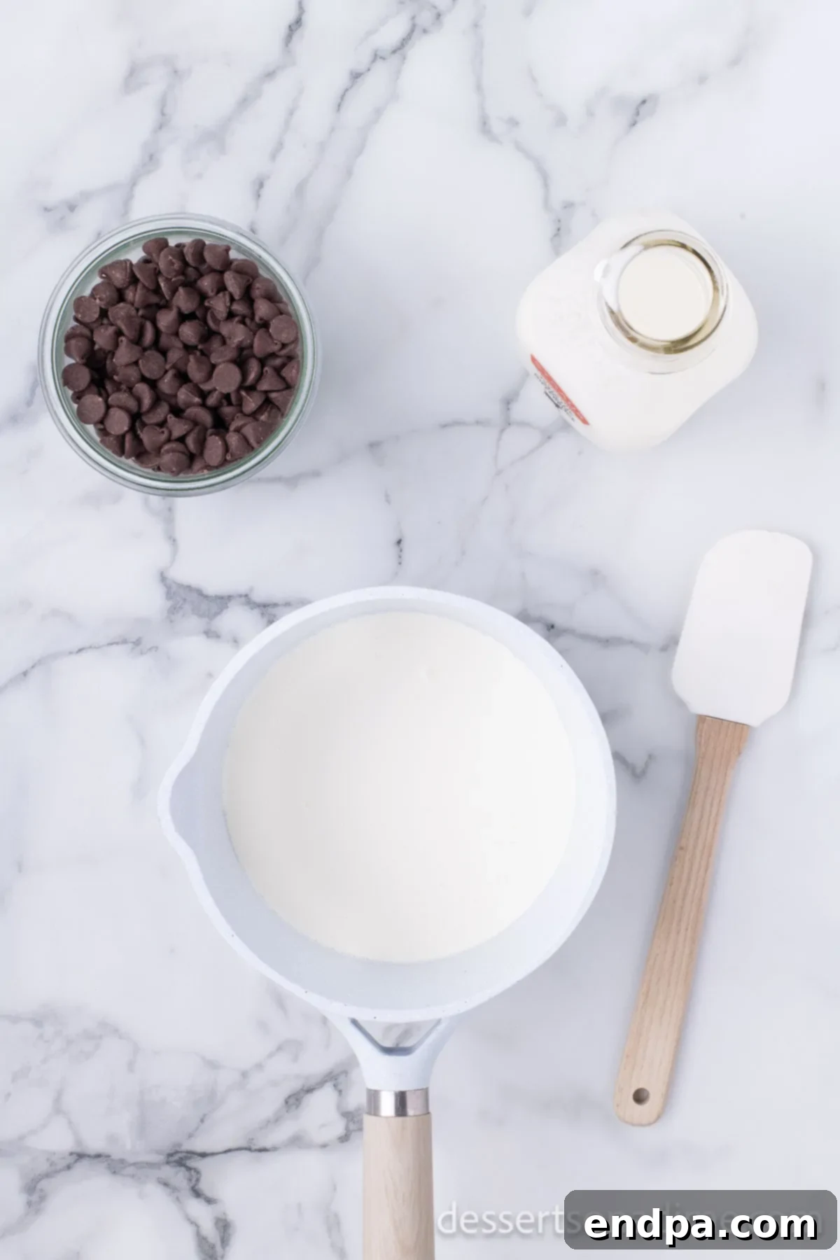 Merry & Bright Brownies 8 Saucepan with heavy cream being heated for ganache preparation.