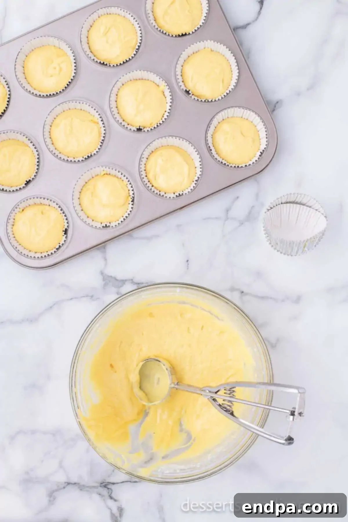 Cake batter going into liners. 