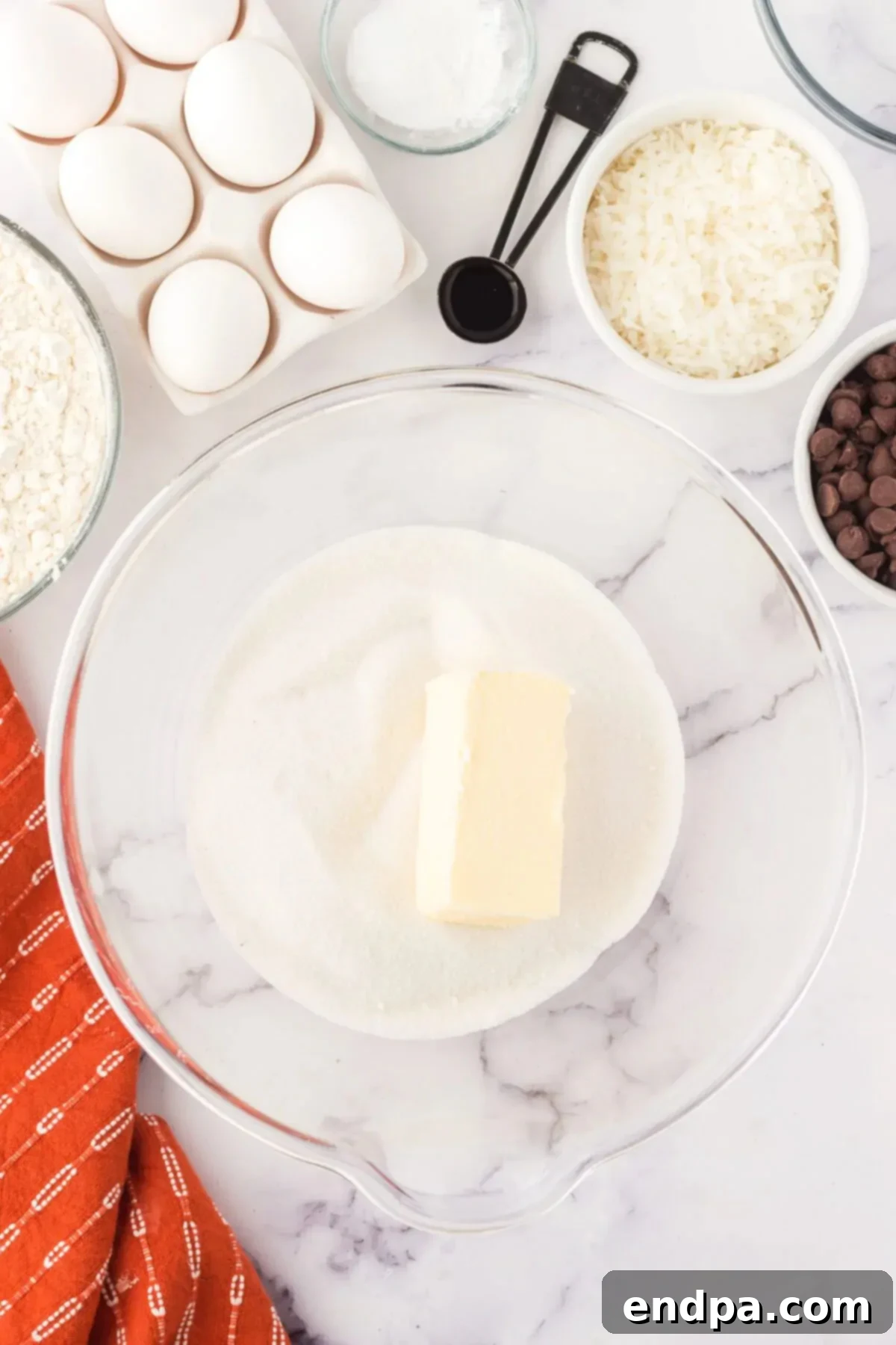 Chewy Coconut Chocolate Chip Dreams 5 Softened butter and granulated sugar combined in a mixing bowl.