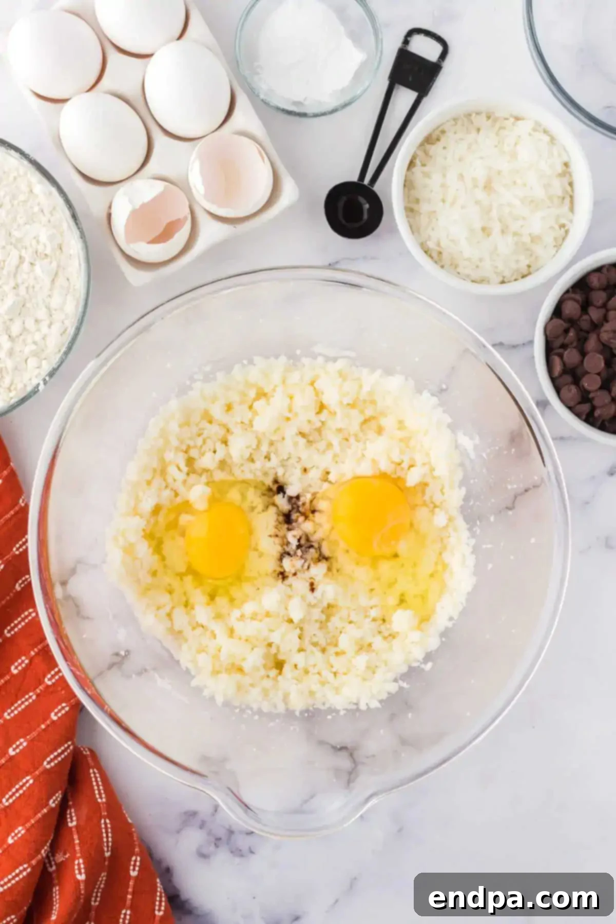 Chewy Coconut Chocolate Chip Dreams 6 Eggs and vanilla extract added to the creamed butter and sugar mixture.