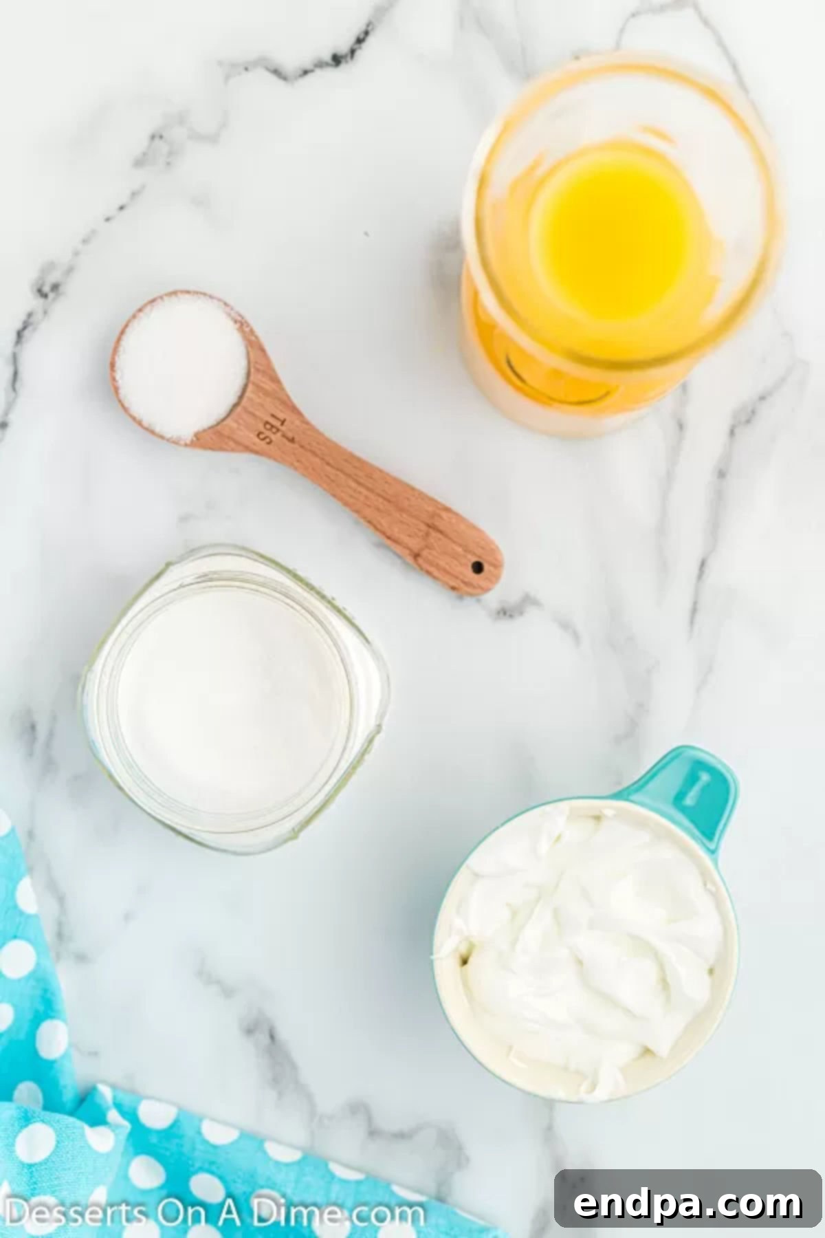 Orange Vanilla Swirl Pop 3 Ingredients for Orange creamsicle popsicles - orange juice, Greek Yogurt, granulated sugar.