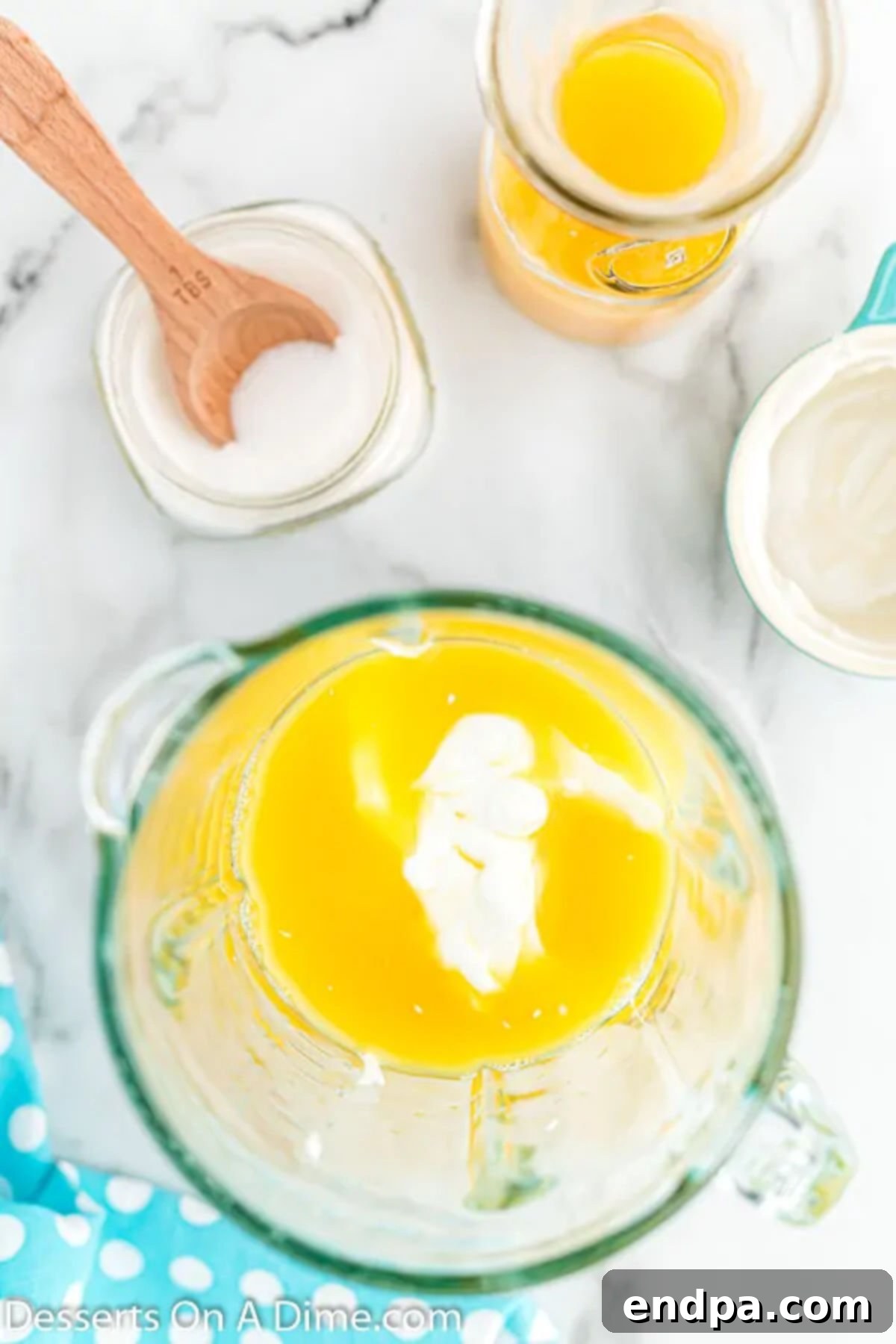 Orange Vanilla Swirl Pop 4 Measuring cup with ingredients mixed together.
