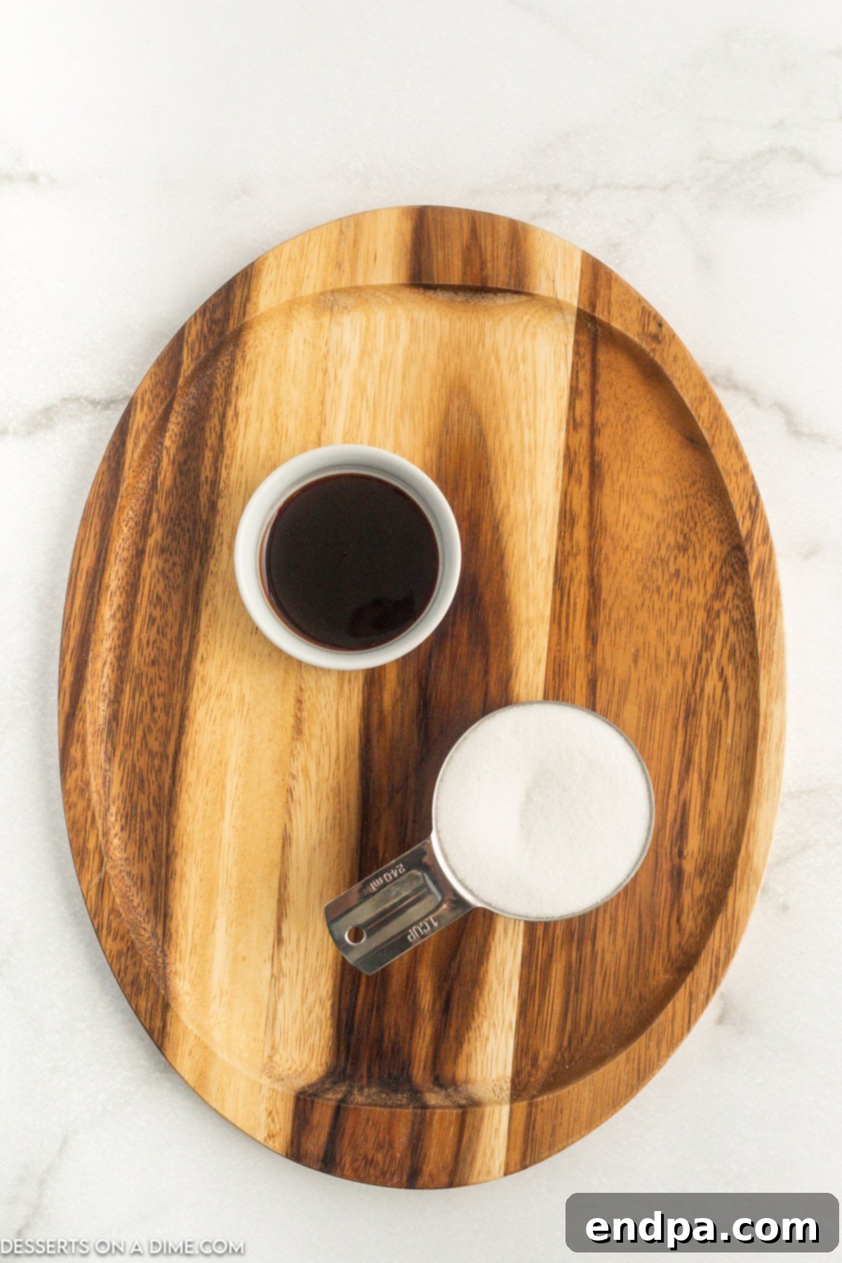 Crafting Your Own Brown Sugar 3 Close up image of white sugar and molasses in a bowl.