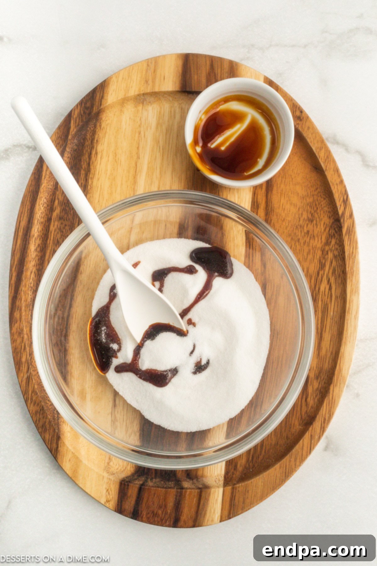 Crafting Your Own Brown Sugar 4 White sugar combined with molasses in a bowl.
