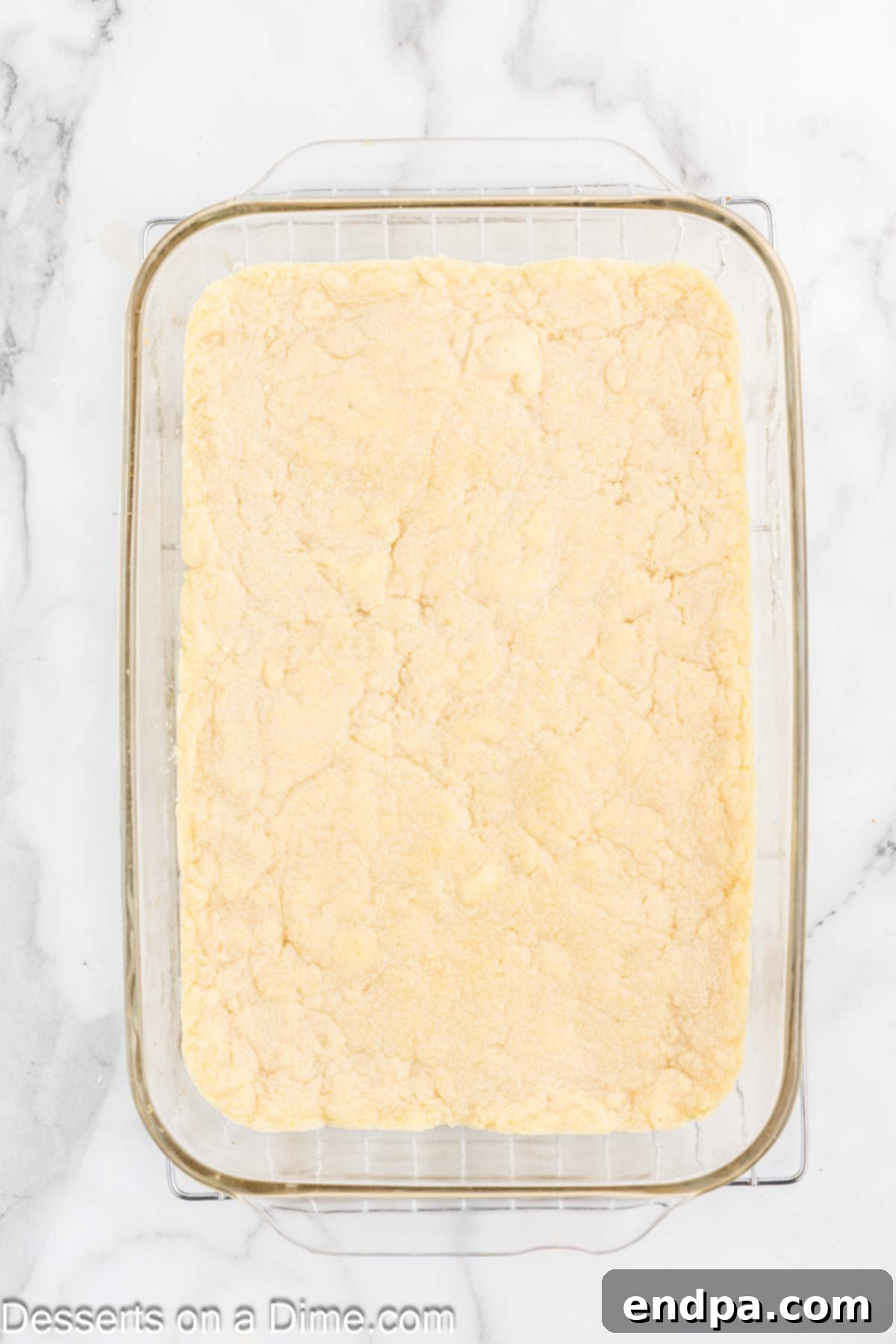 Perfectly Soft Sugar Cookie Bars 7 Baked sugar cookie bars cooling in the pan on a wire rack.