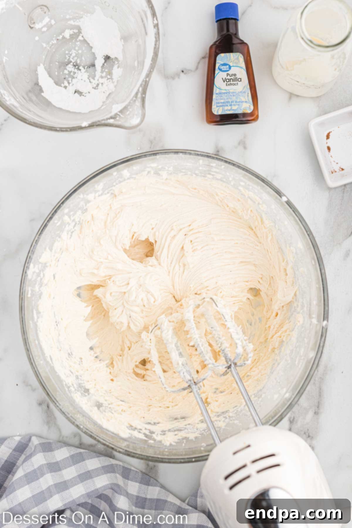 Festive Eggnog Cupcakes 12 Smooth and creamy eggnog buttercream frosting in a mixing bowl, ready for piping.