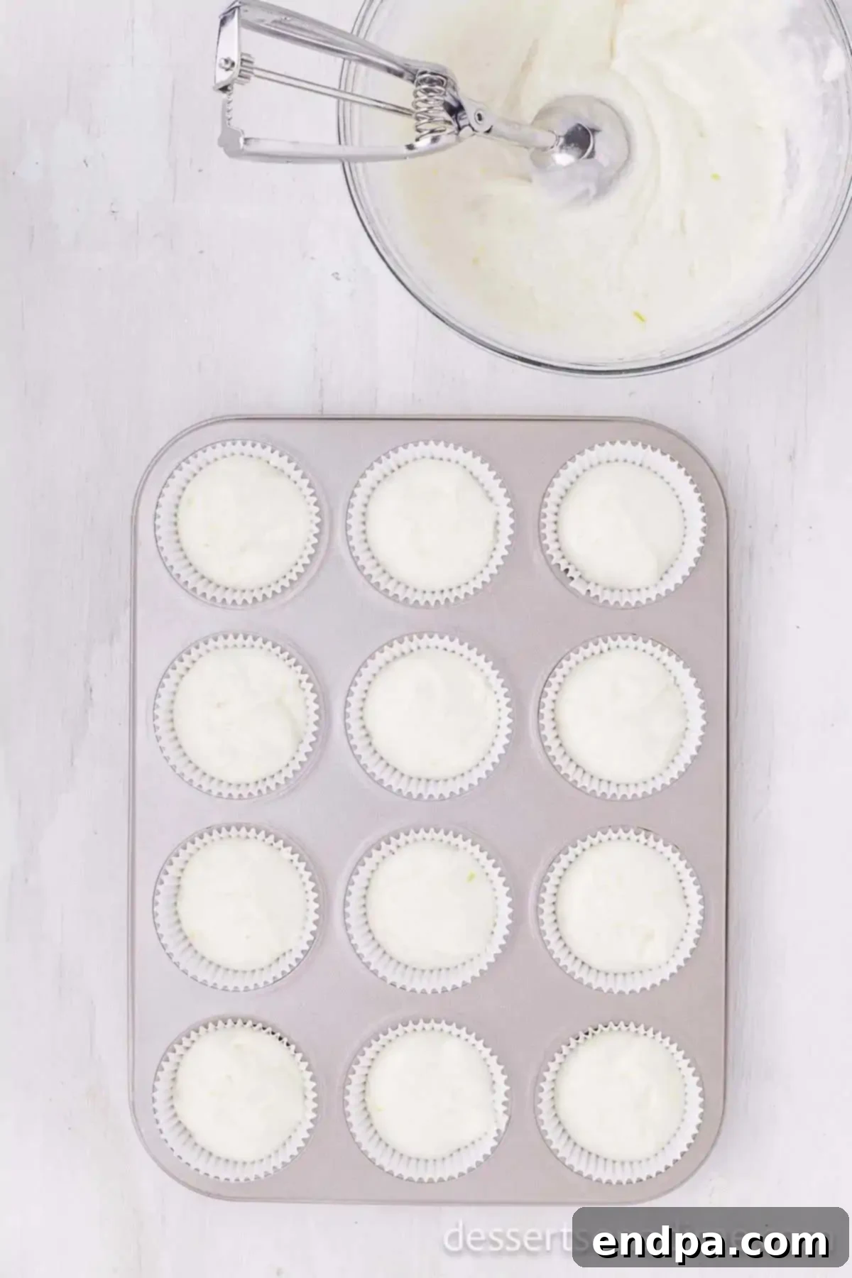 Tequila Lime Cupcakes 5 Cupcake batter in muffin tins.