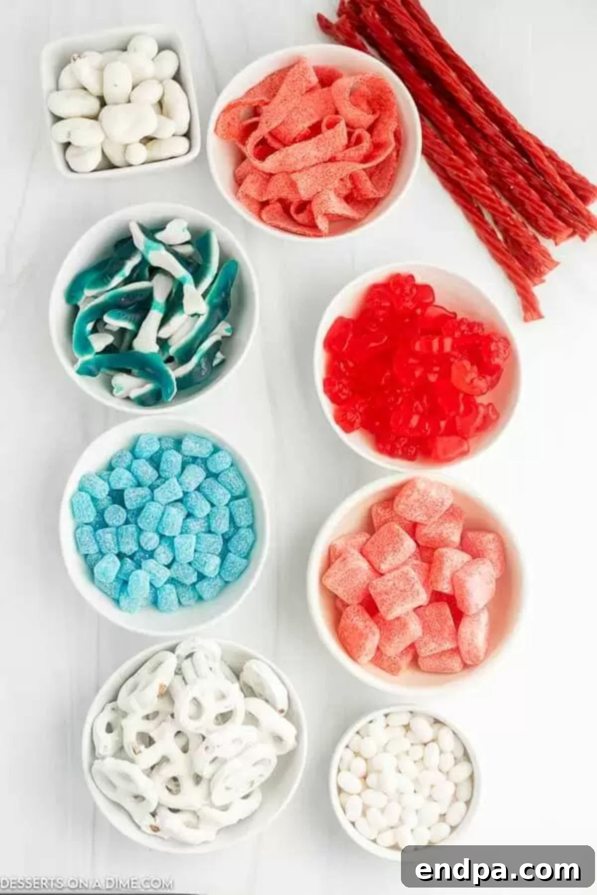 Ingredients for American flag candy charcuterie board- assorted candy, treats and nuts.