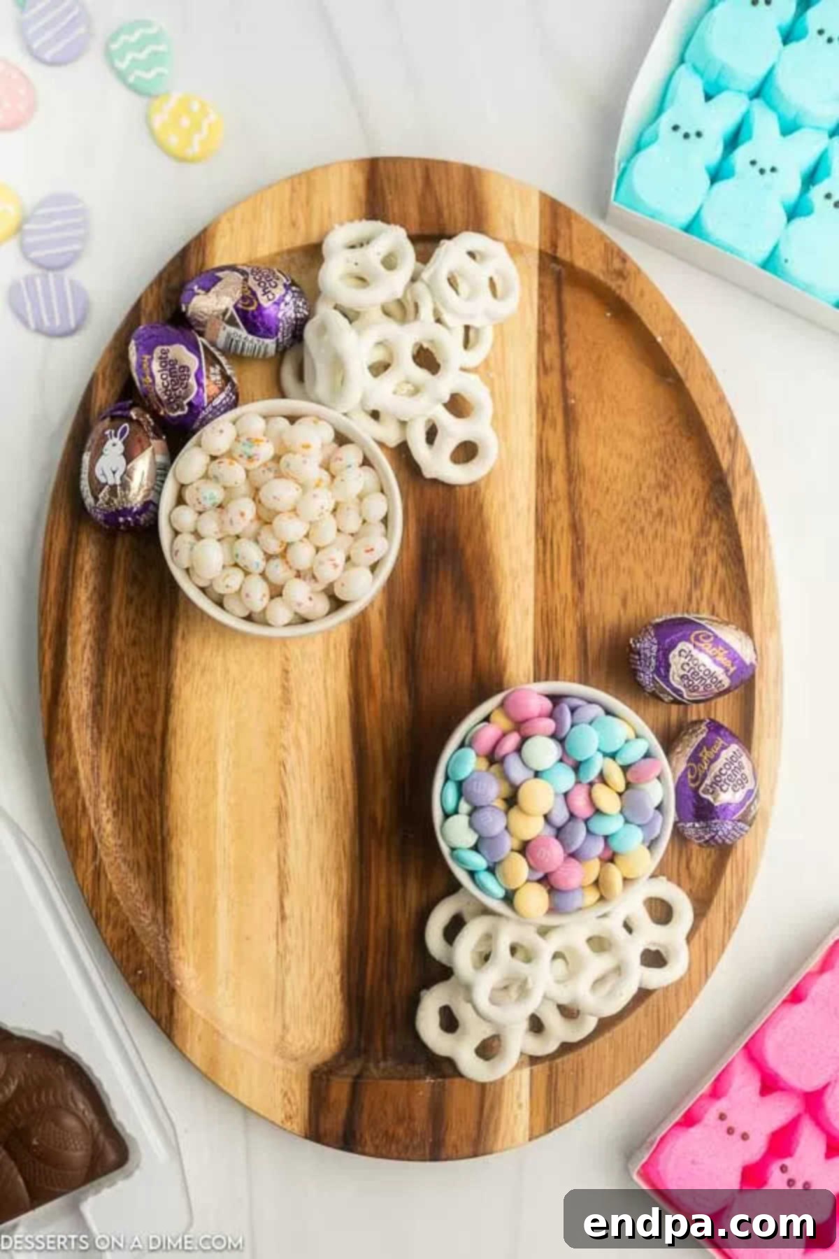 Board with colorful Easter candy arranged in clusters.