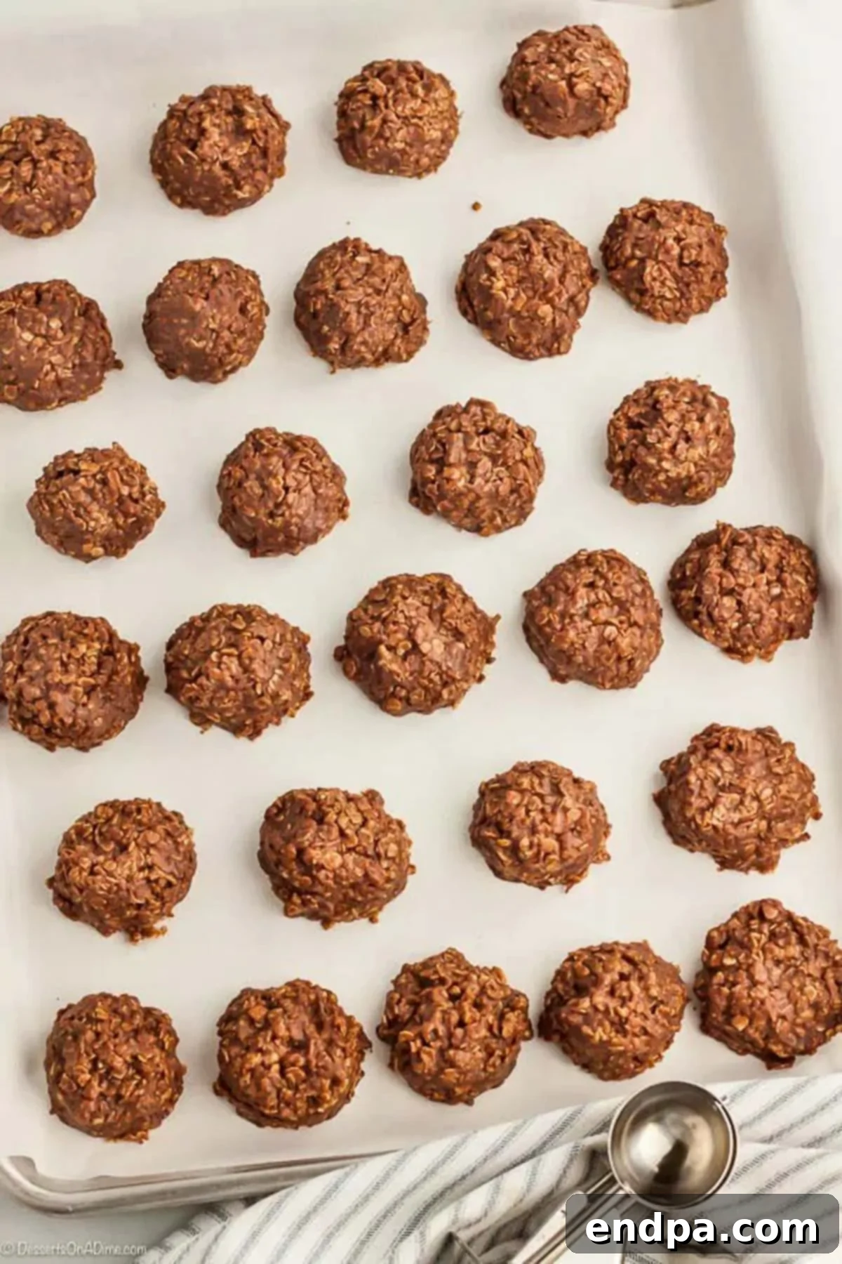 Effortless No-Bake Cookies 3 No Bake Cookies placed on a baking sheet.