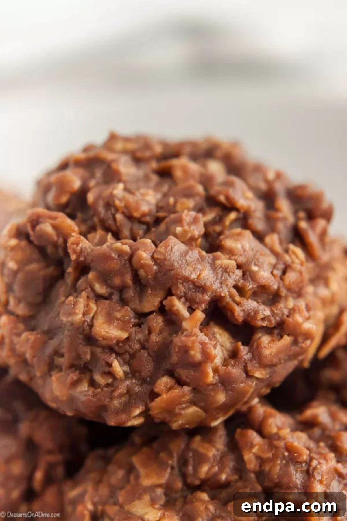 This Easy No Bake Cookies Recipe is simple to make and has a tasty combination of peanut butter and chocolate. Anytime we want a treat fast, we make this! No Bake Cookies stacked together, ready to be enjoyed.