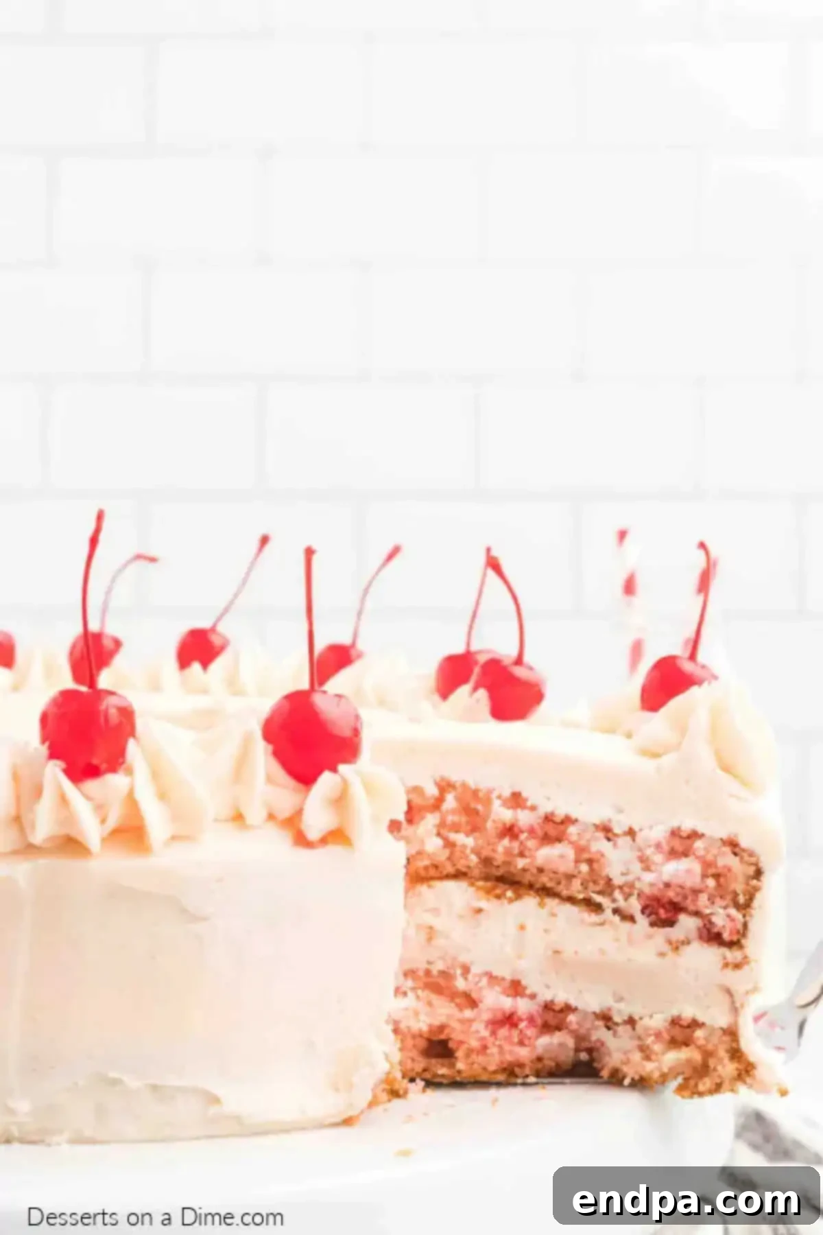 A beautifully decorated cherry chip cake with pink buttercream icing.