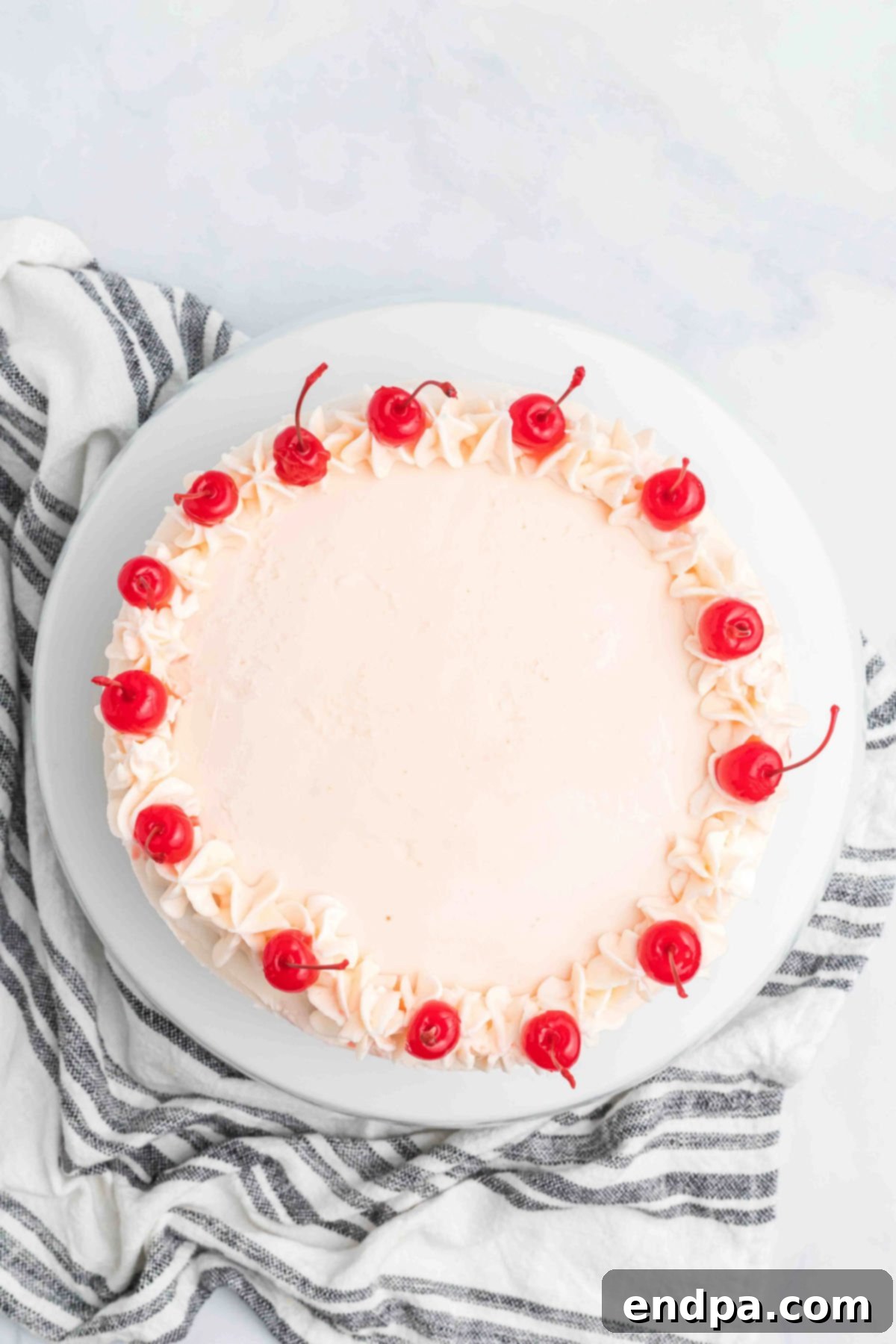 Cherries added to the top of the cake.