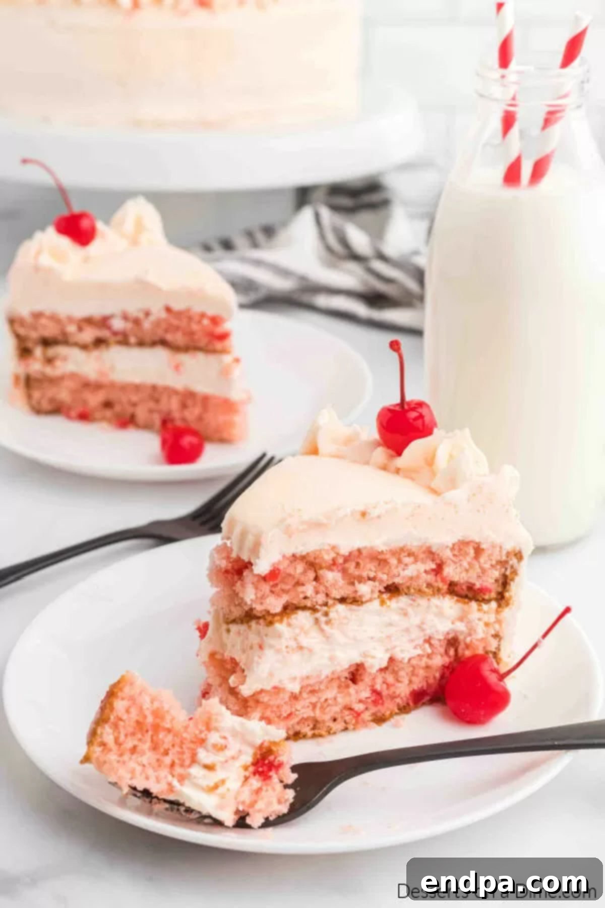 Slice of cherry chip cake on a plate.
