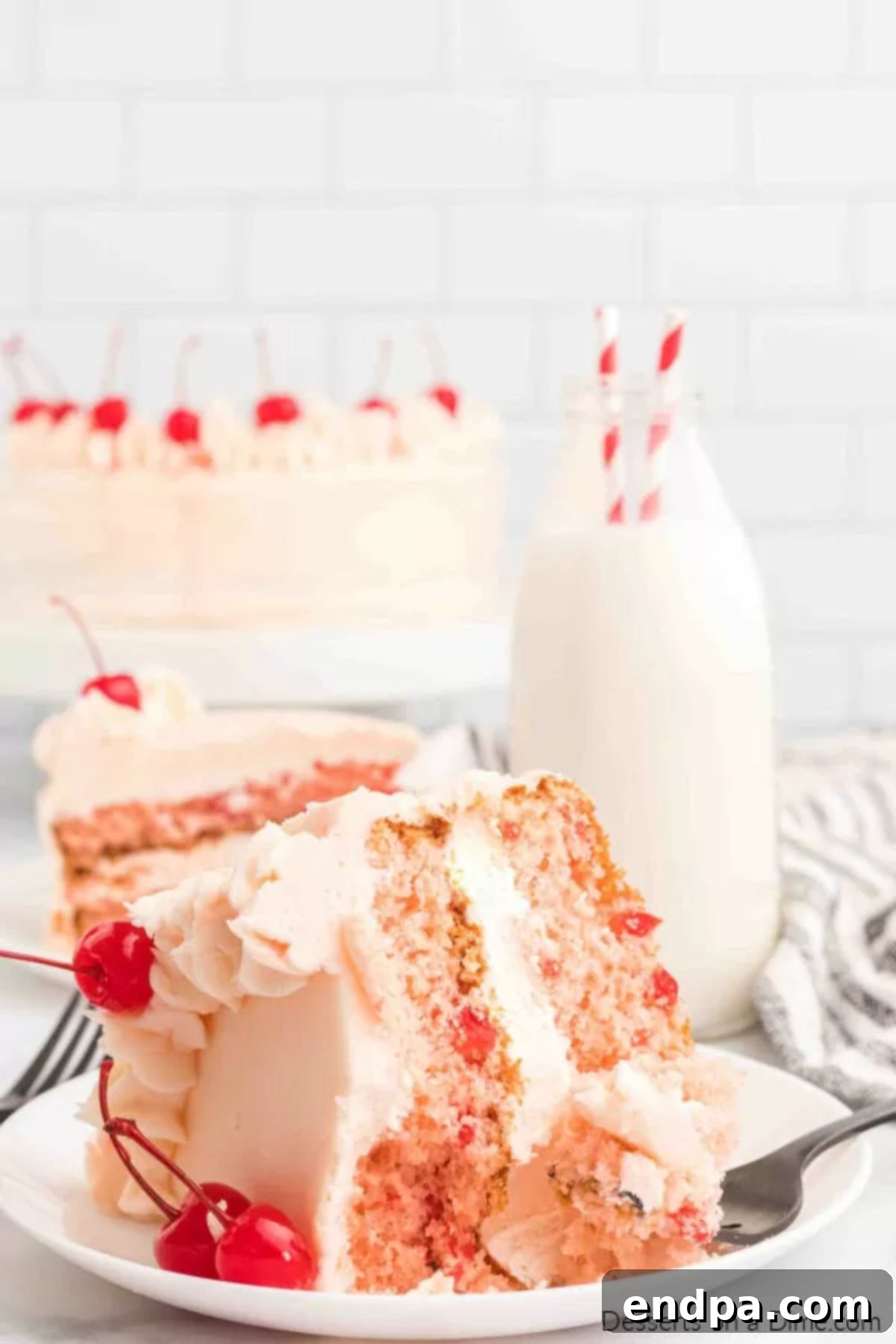 Slice of cherry chip cake on a plate.