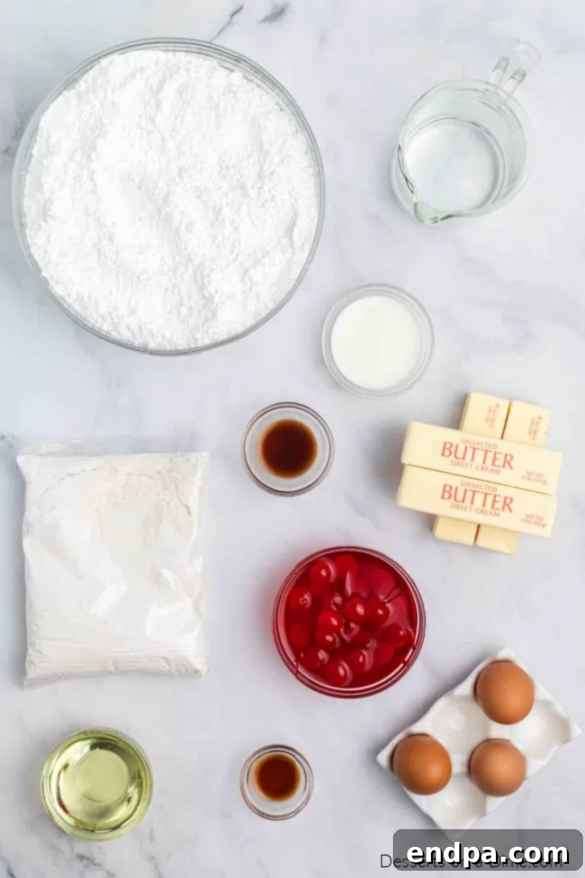 Ingredients for cherry chip cake -white cake mix, cherries, eggs, vanilla, butter, vanilla, powdered sugar and milk.