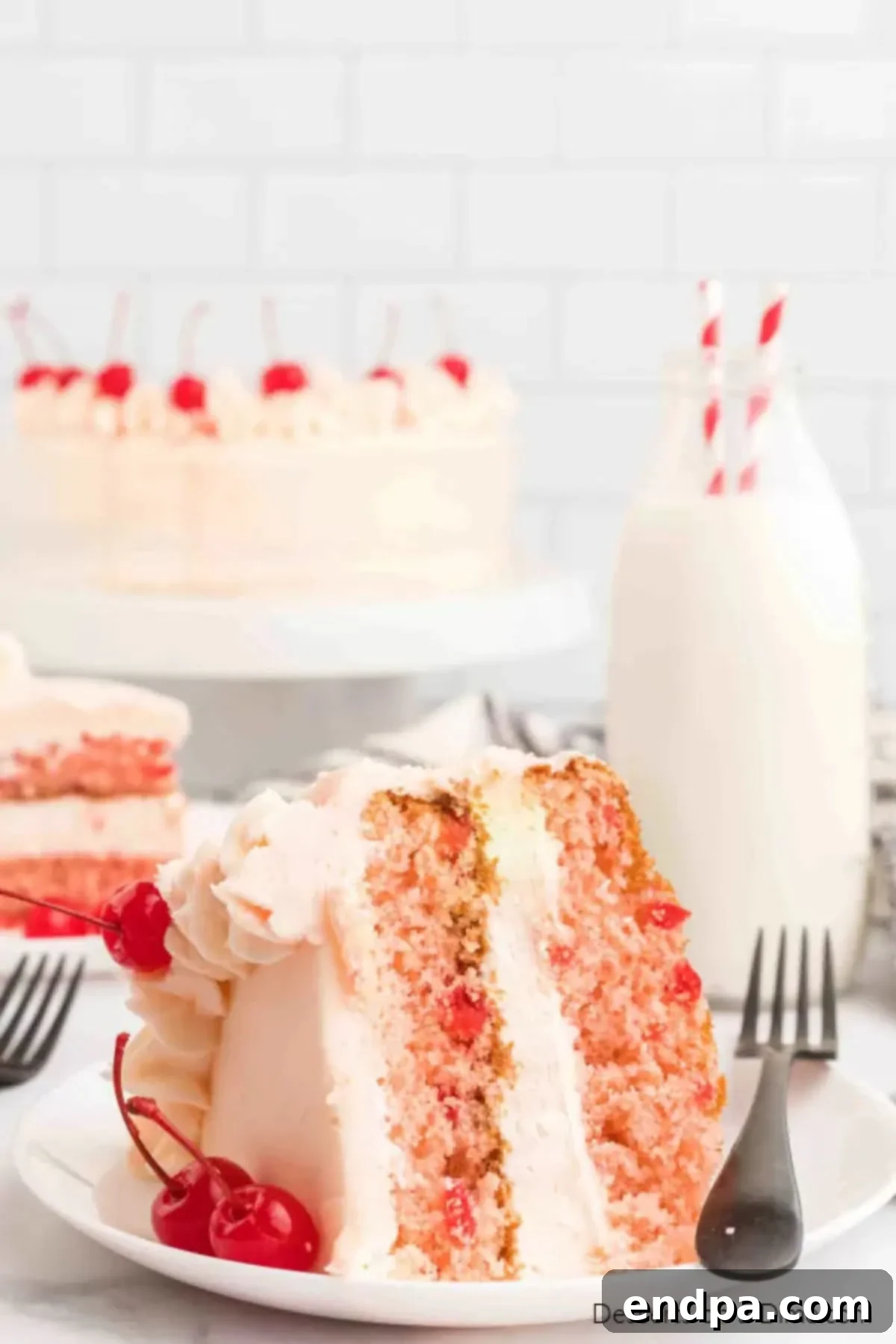 Slice of cherry chip cake on a plate.