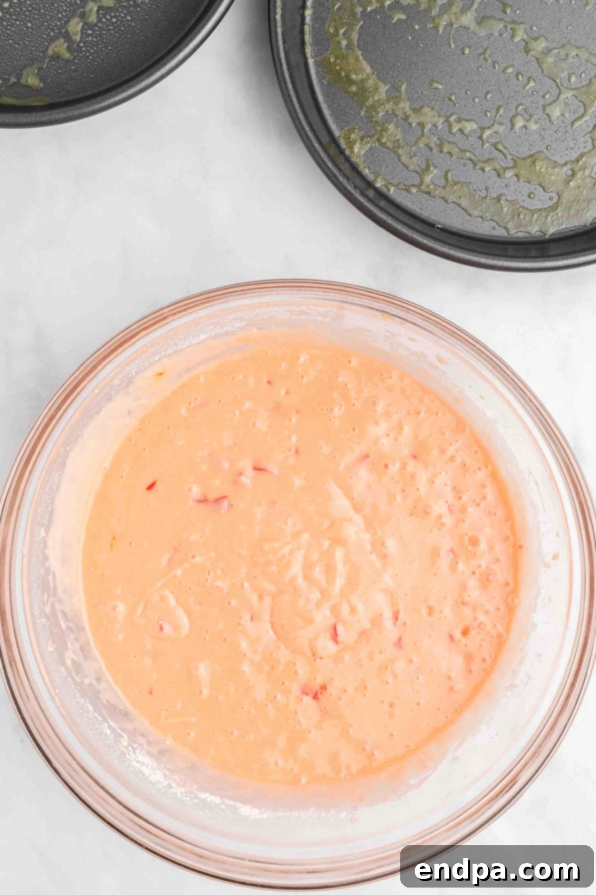 Wet and dry ingredients combined in mixing bowl.