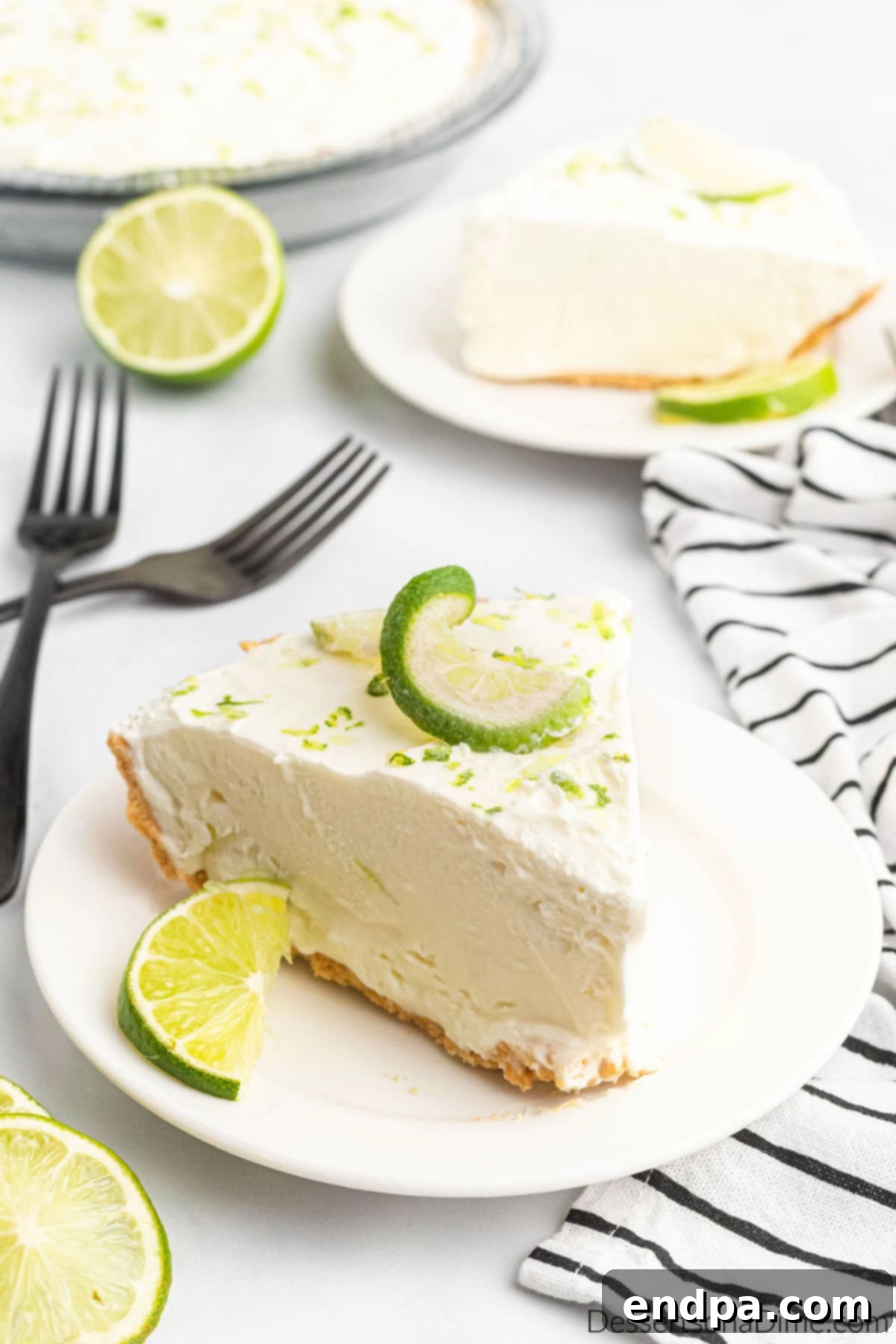 Slice of Margarita pie, showcasing its creamy texture and vibrant lime color.