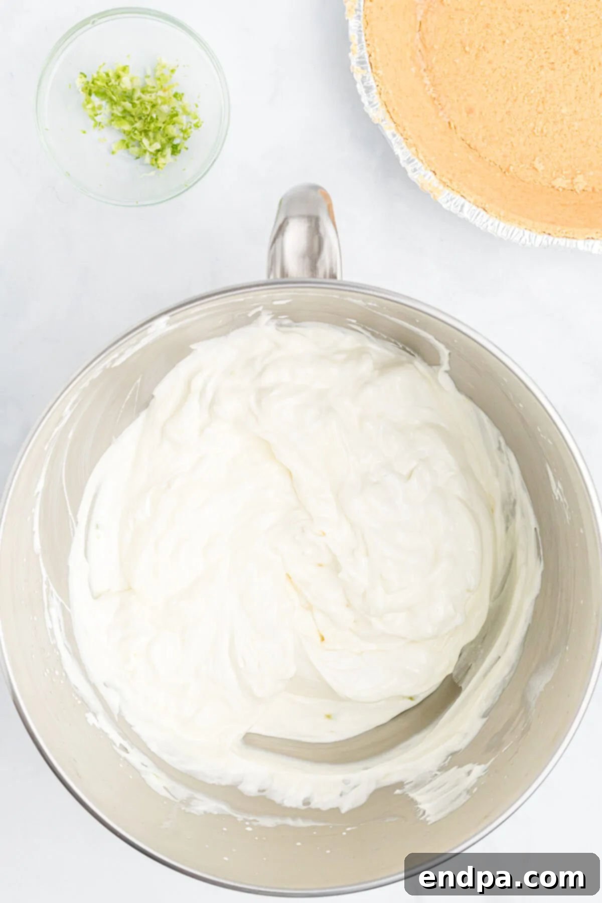 Bowl with heavy cream beaten until stiff peaks form.