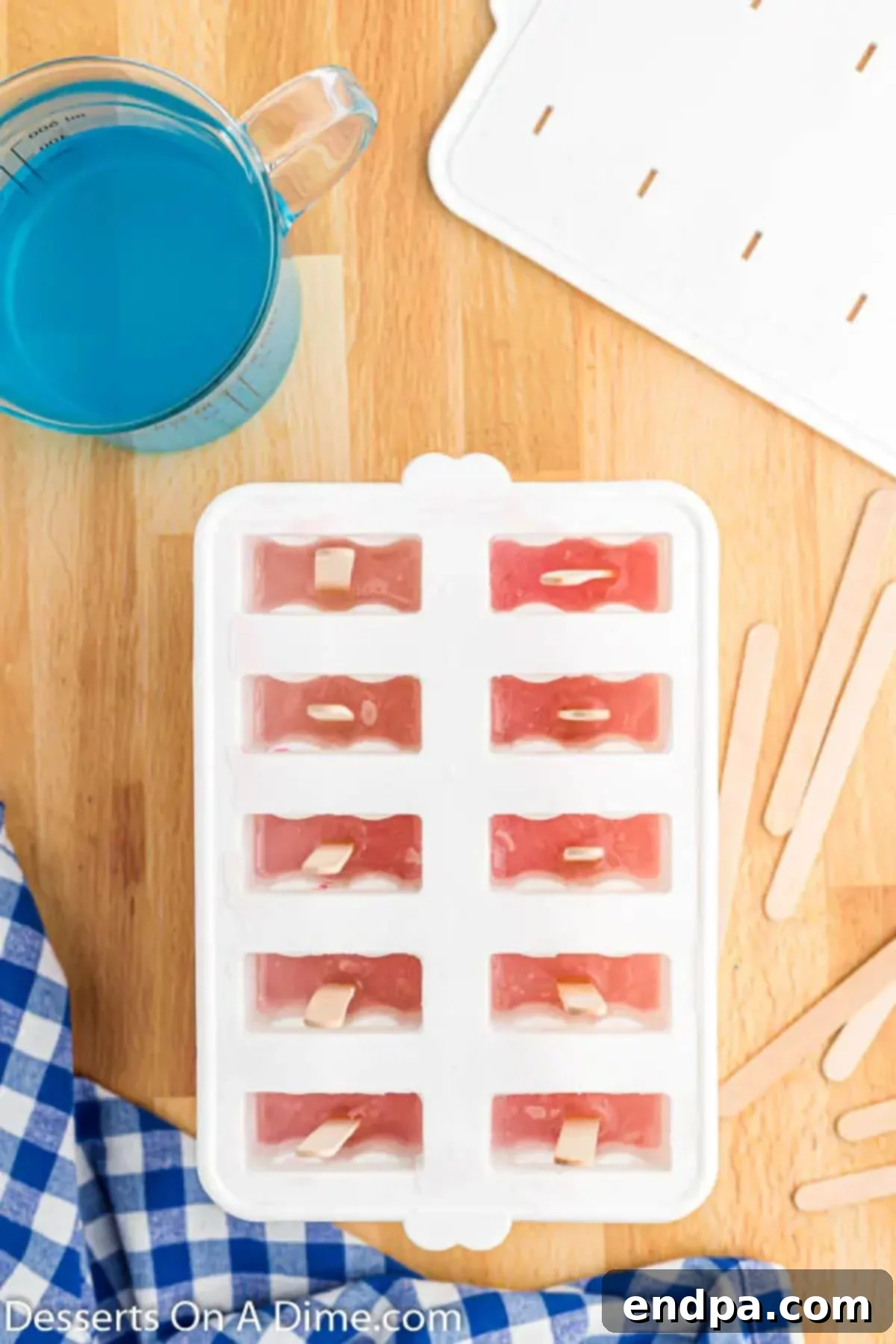 Second layer: Lemonade is carefully poured over the frozen cranberry juice.