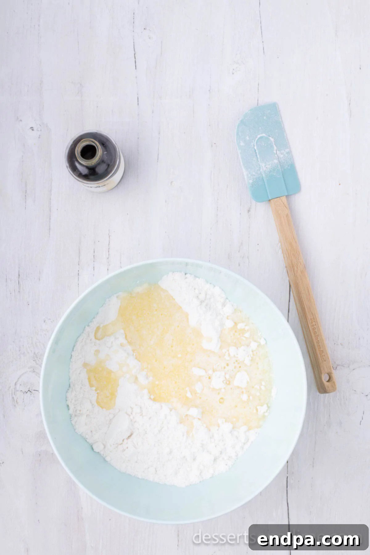Mixing bowl with ingredients being combined. 
