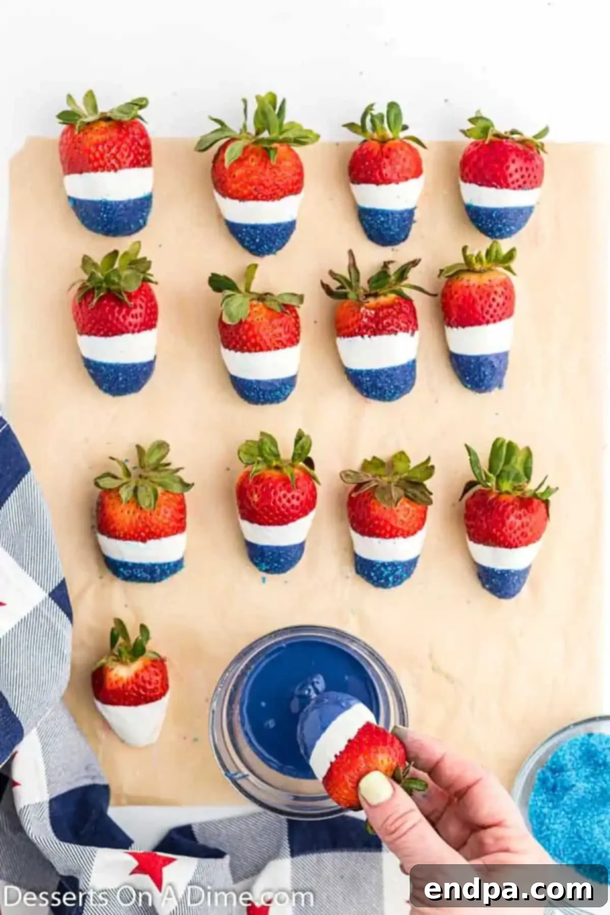 Strawberries with white coating, then dipped in blue candy melts and covered in blue sprinkles.