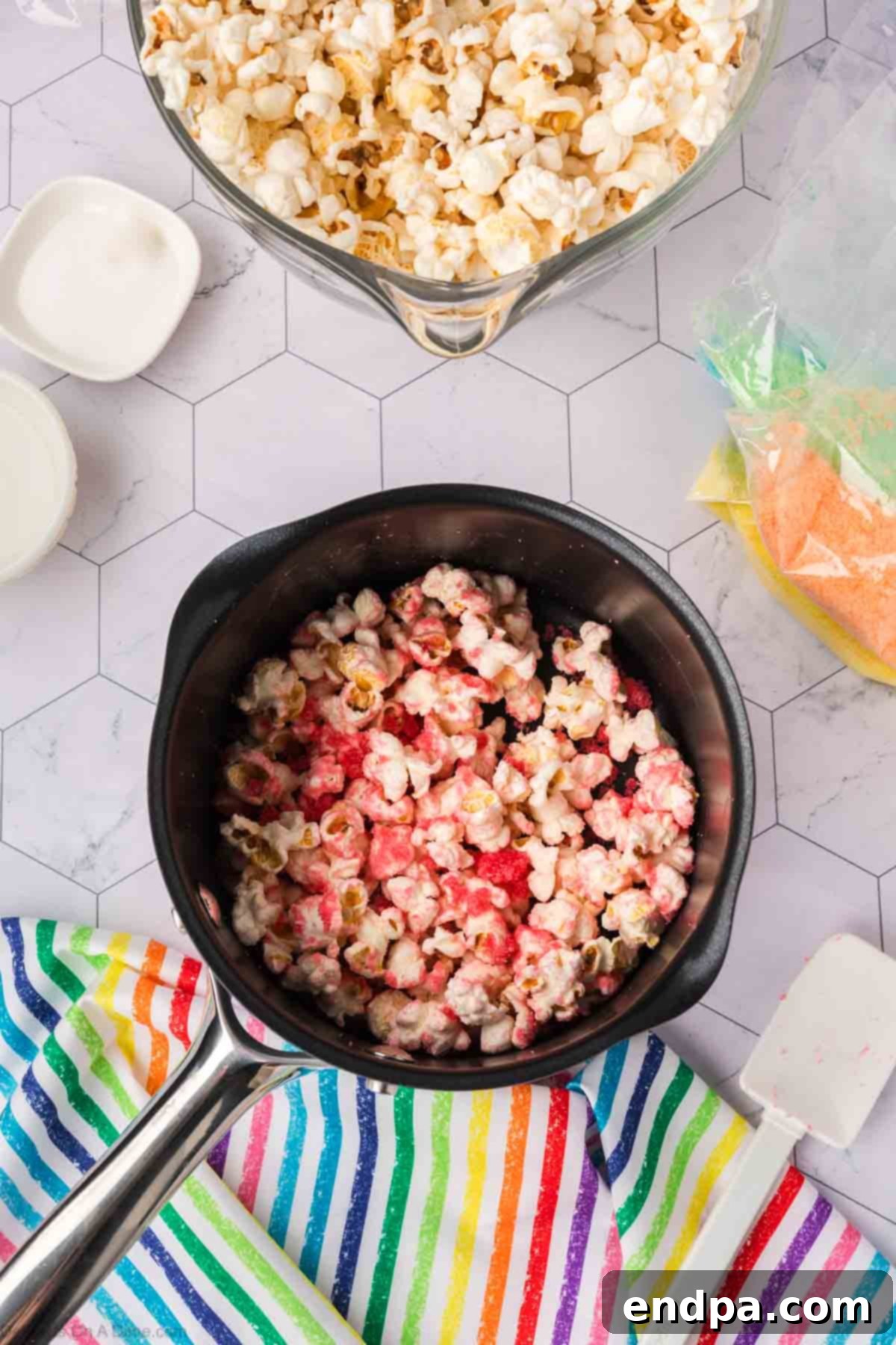 Kaleidoscope Kernels 11 Popcorn added to the sugar mixture.