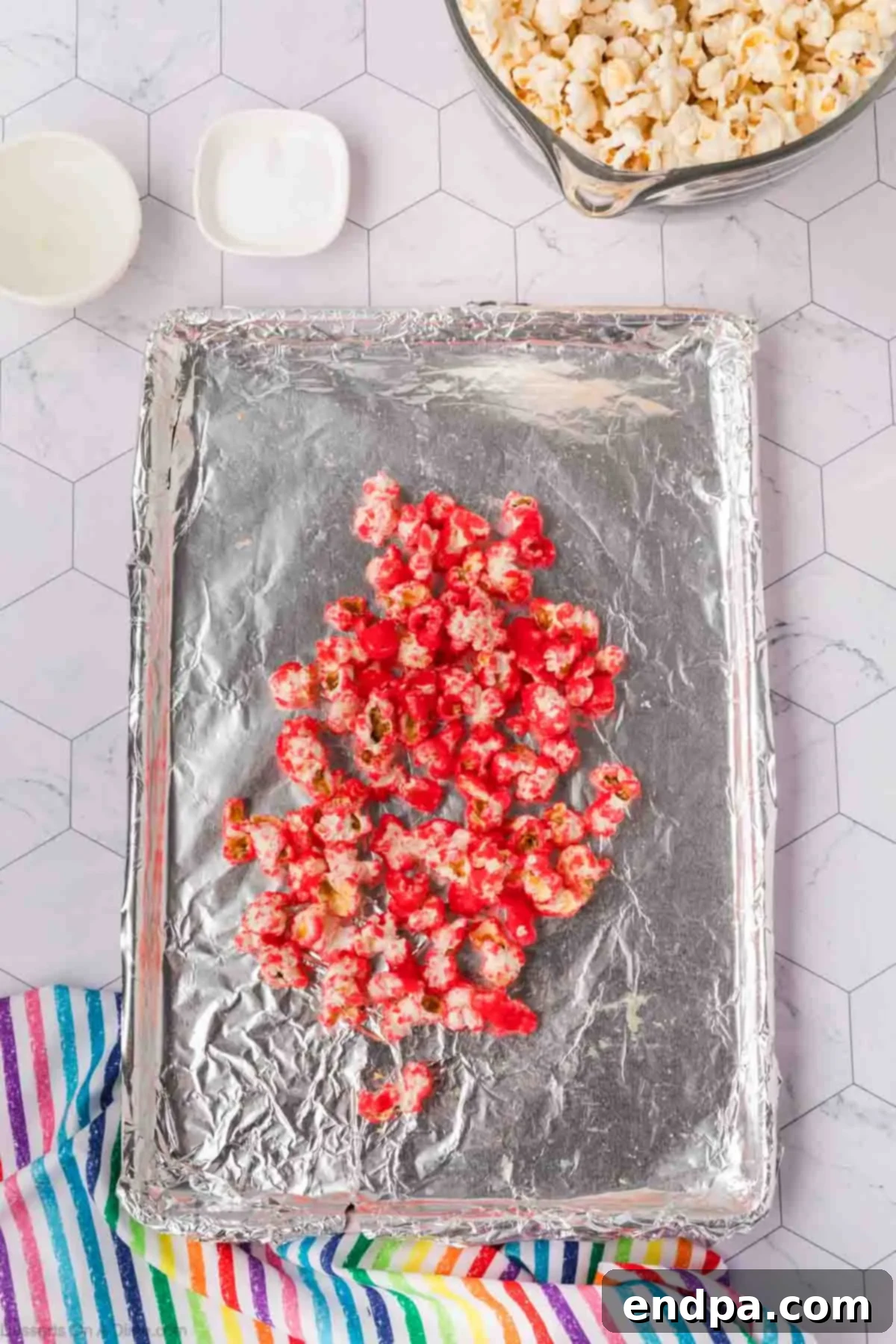 Kaleidoscope Kernels 12 Popcorn spread on baking sheet.