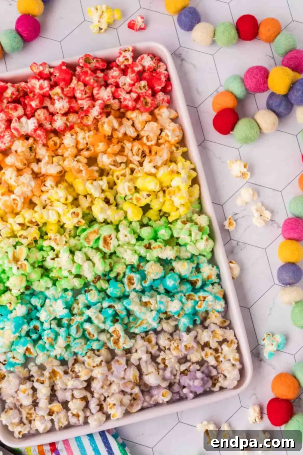 Kaleidoscope Kernels 14 Popcorn on baking sheet separated by colors.