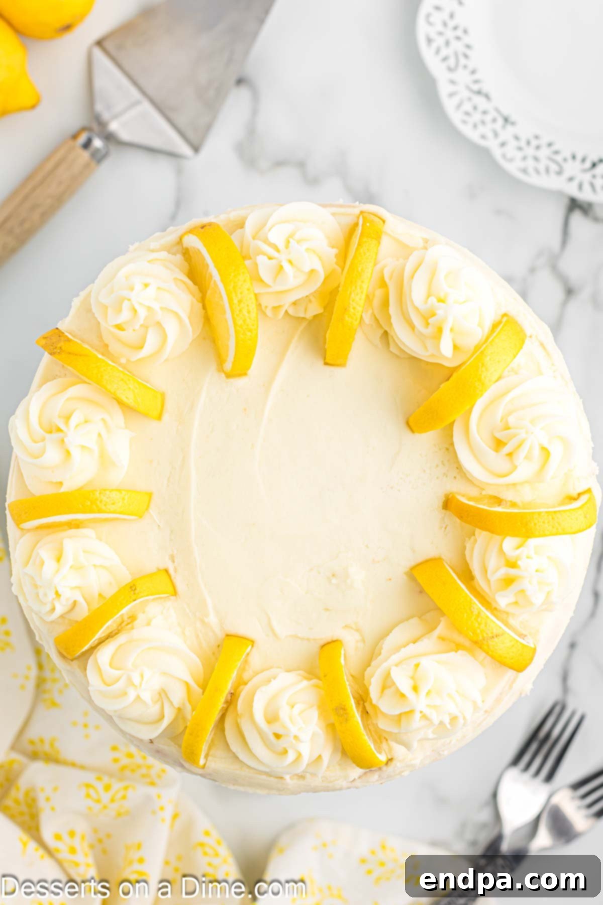 Sunshine Lemon Cake 12 Overhead photo of a beautifully decorated lemon cake on a serving dish.