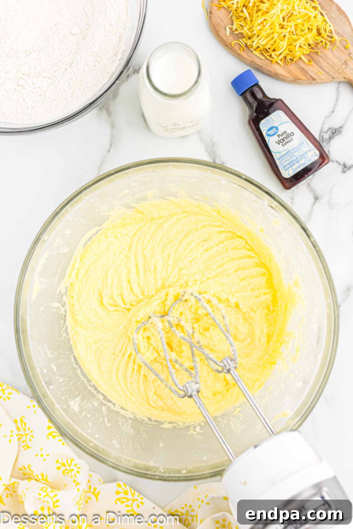 Sunshine Lemon Cake 5 Mixing bowl with butter and sugar being creamed together until light and fluffy.