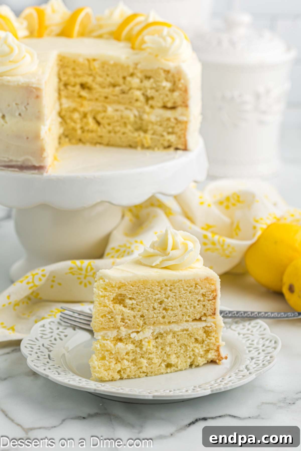 Sunshine Lemon Cake 10 A single slice of lemon cake on a plate, showing its fluffy layers and frosting.