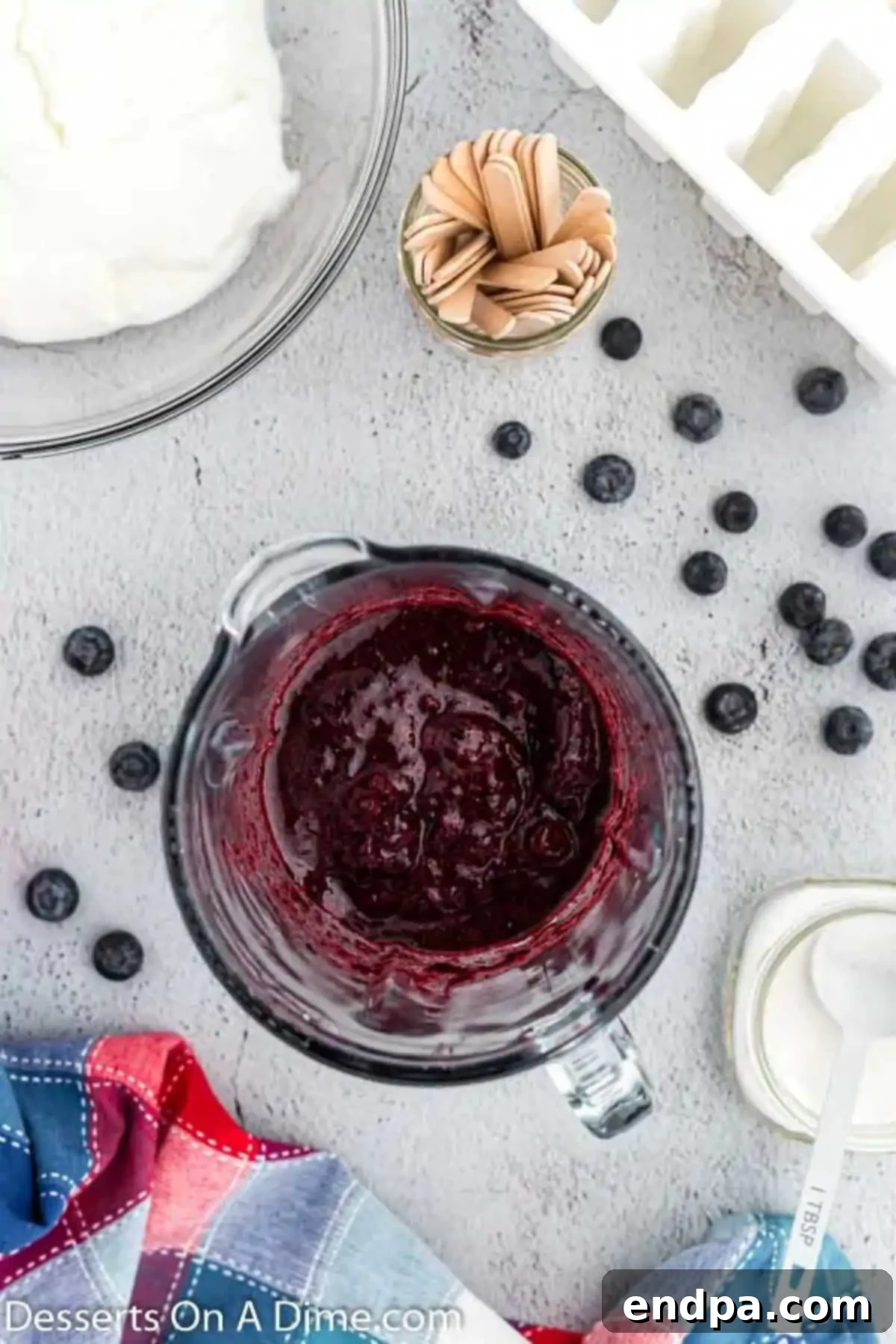 Blueberries and sugar in blender. 