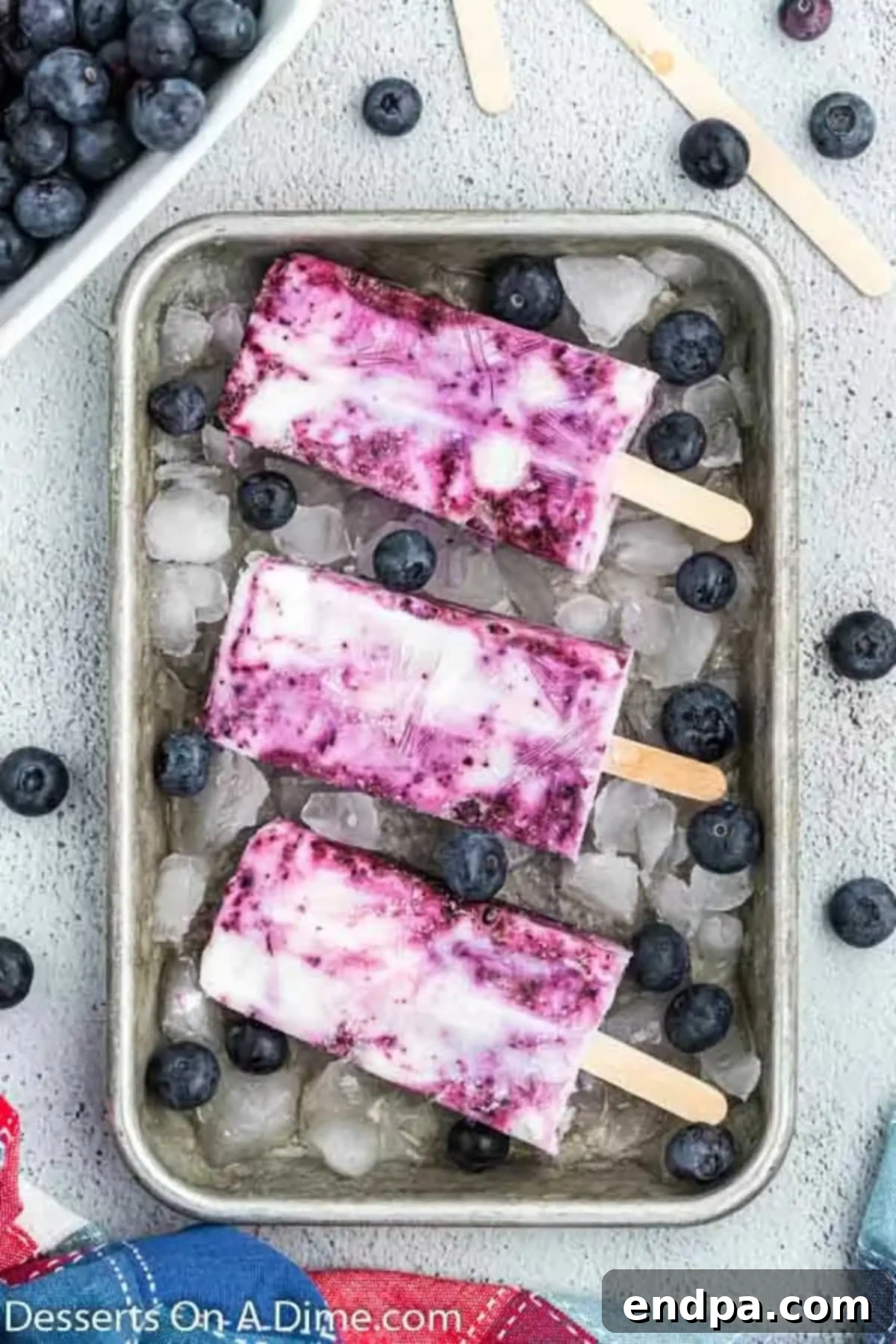 Blueberry popsicles on a tray. 
