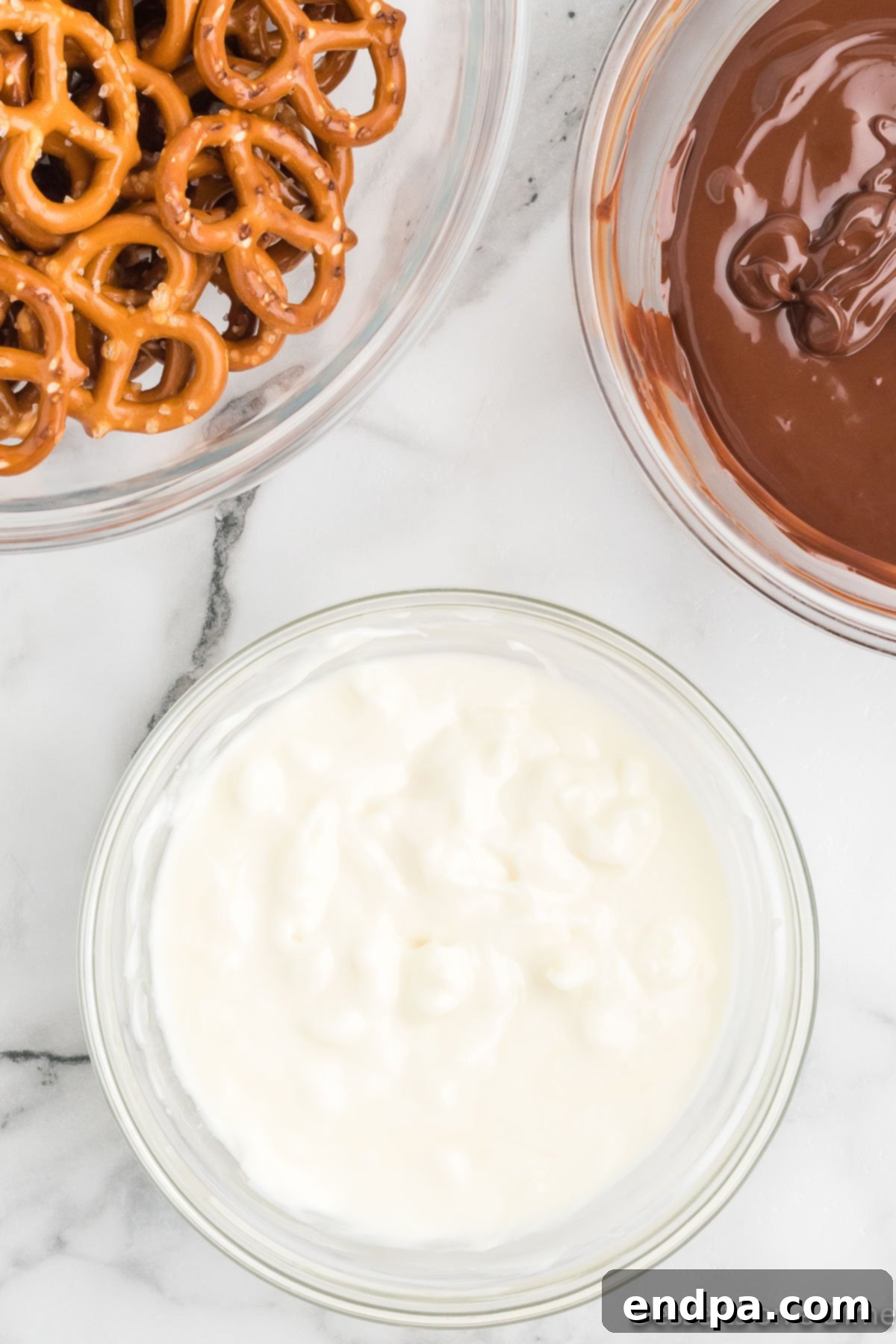 A separate bowl holds beautifully melted white chocolate, ready for dipping.