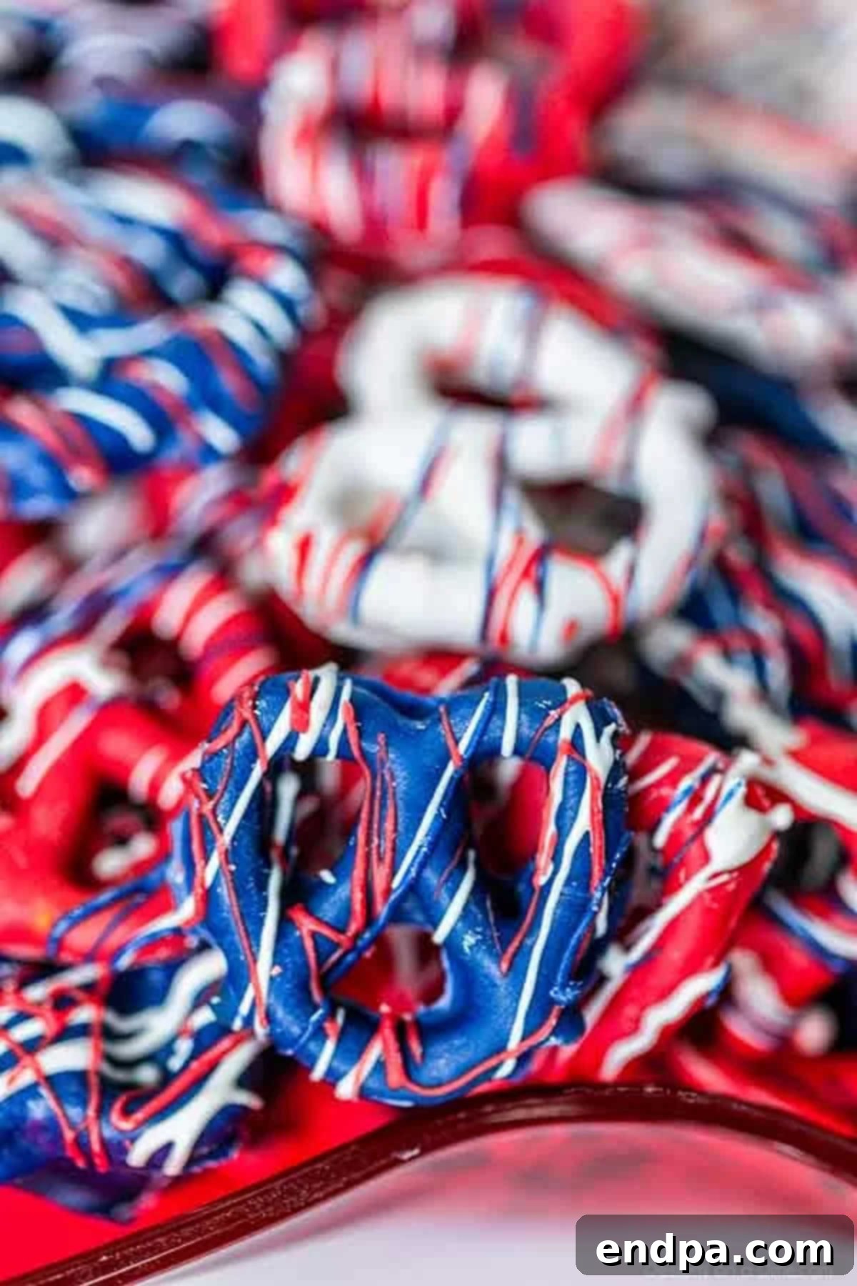 Beautifully decorated Red, White, and Blue Chocolate Covered Pretzels ready for serving.