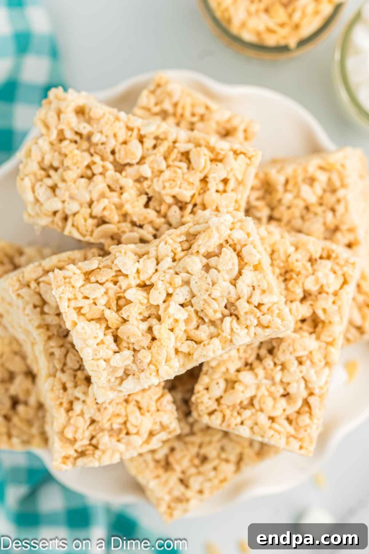 Crispy Marshmallow Bars 2 Platter of golden, perfectly square homemade Rice Krispie treats, ready to be enjoyed.