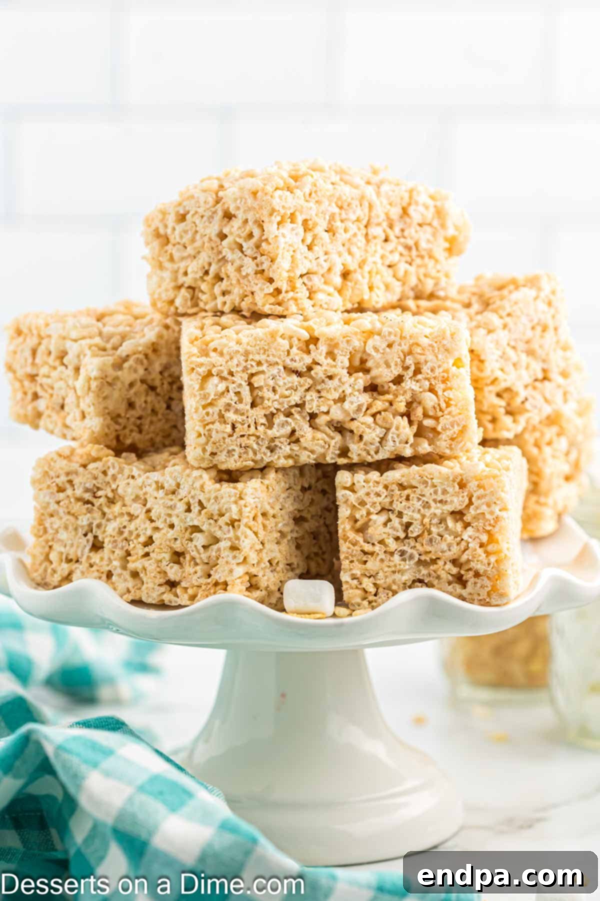 Crispy Marshmallow Bars 13 A beautiful platter of perfectly cut, golden homemade Rice Krispie treats, ready for serving.