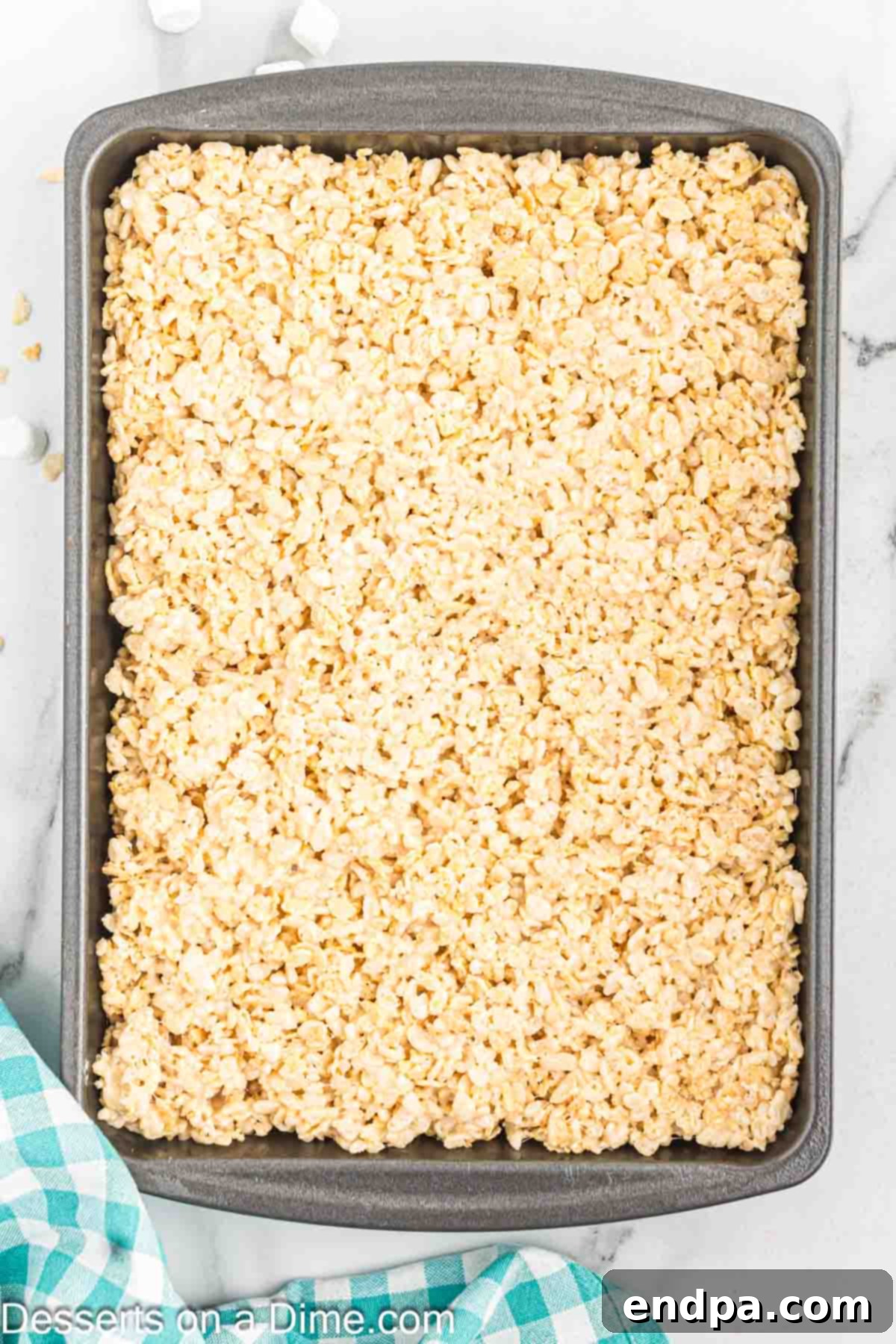 Crispy Marshmallow Bars 9 The Rice Krispie treat mixture evenly pressed into a prepared 9x13 inch baking pan.