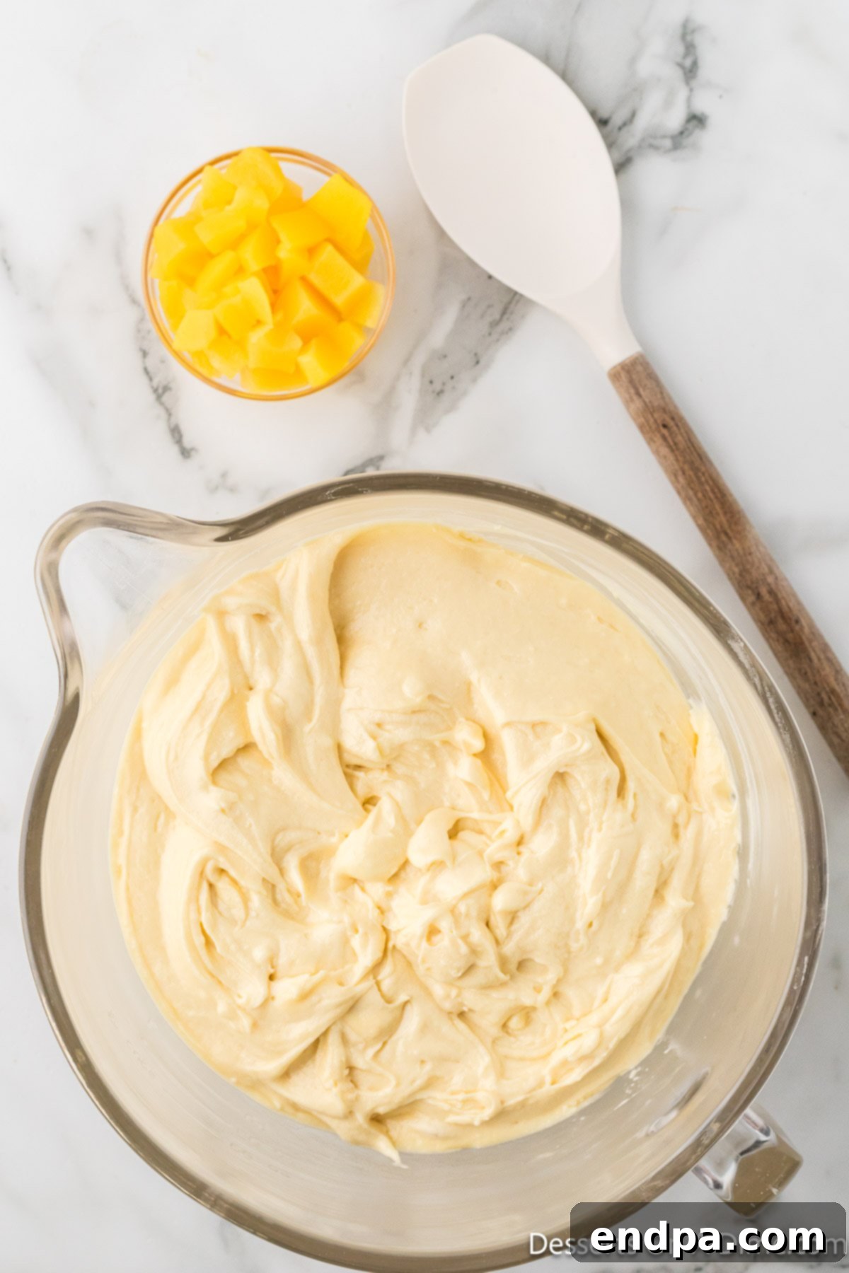 The flour mixture fully incorporated into the wet ingredients, creating a smooth and uniform cake batter.