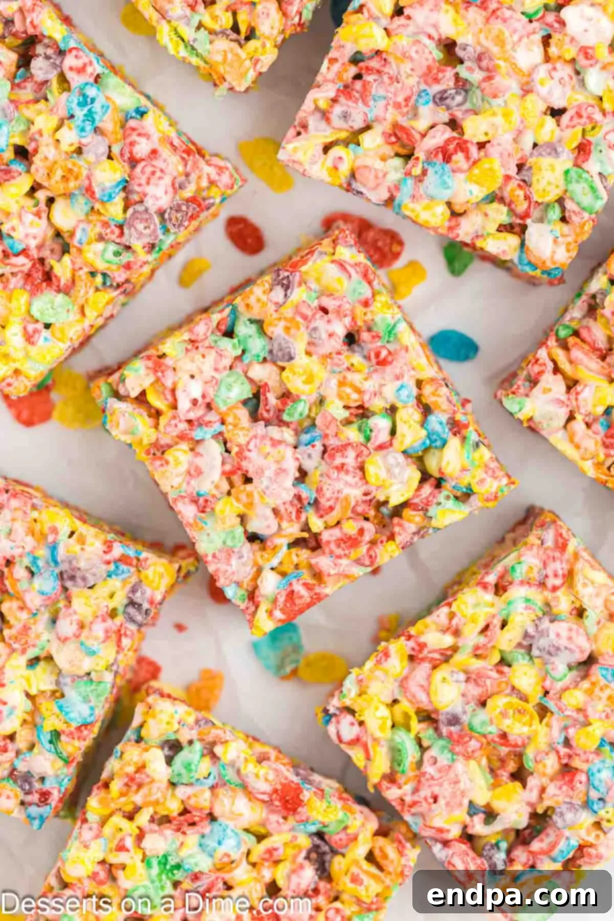 Close-up of Fruity Pebbles bars, showing the colorful cereal and the texture of the treats.