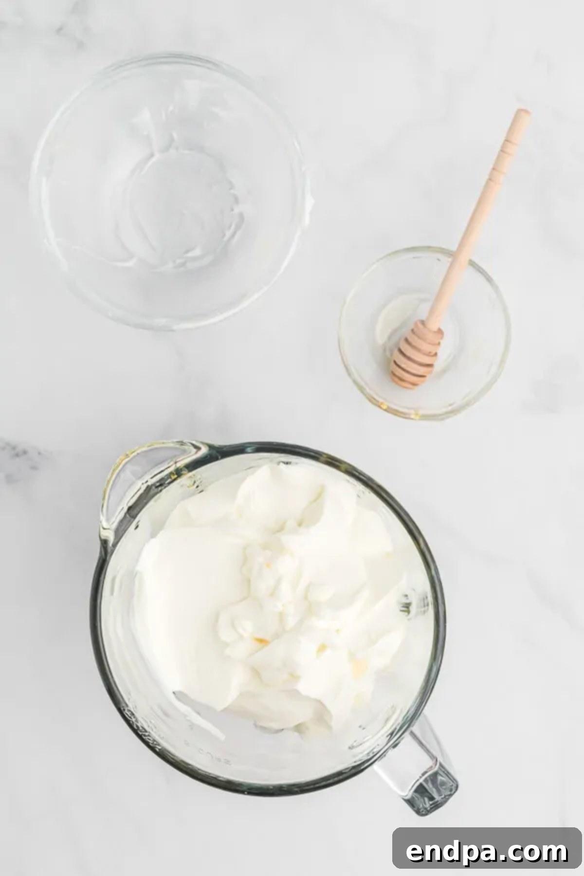 Refreshing Blueberry Yogurt Pops 3 Bowl with plain Greek yogurt and honey.