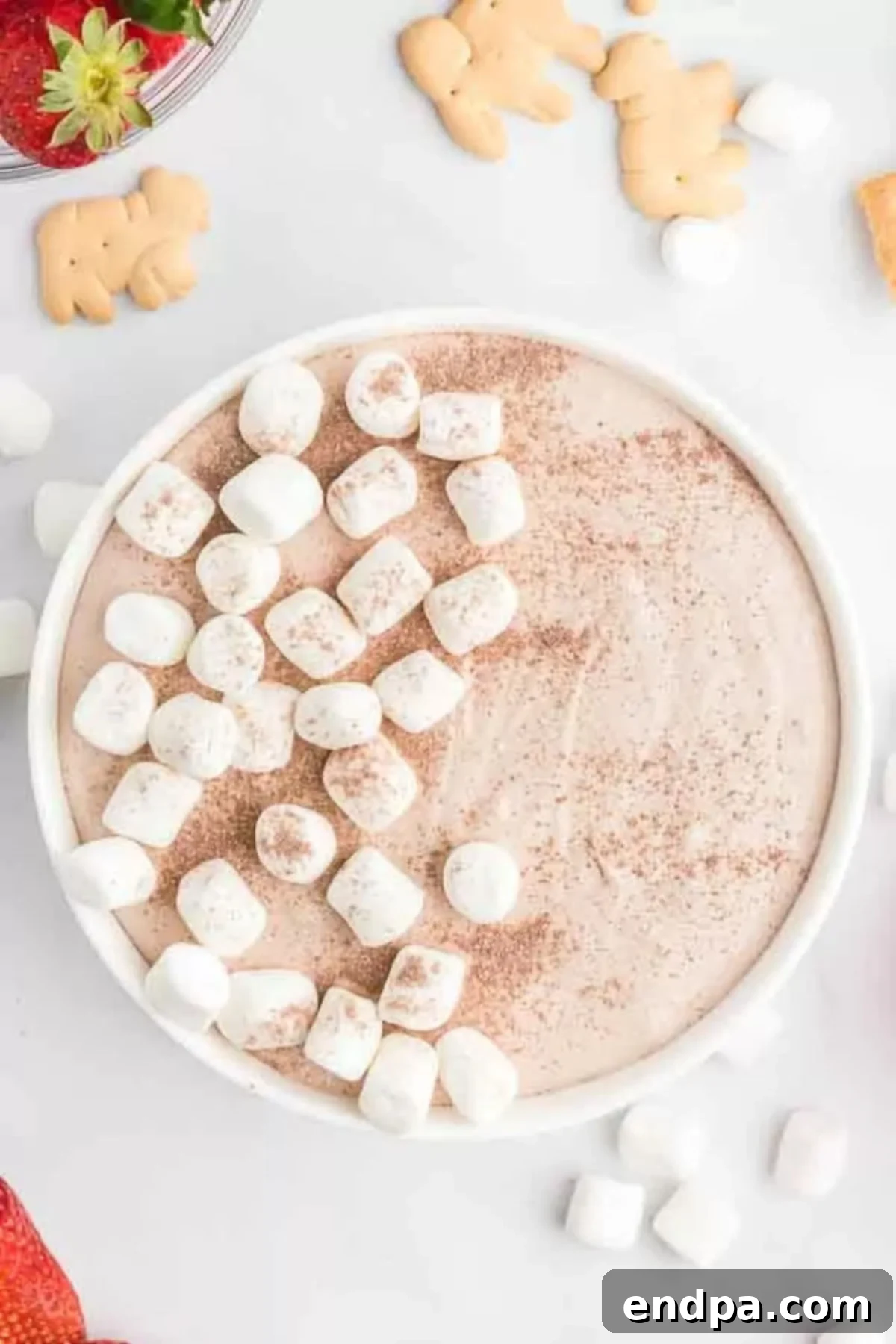 Decadent Hot Chocolate Dip 2 Rich Hot Chocolate Dip served in a festive bowl, garnished with mini marshmallows and chocolate shavings, ready for dipping.