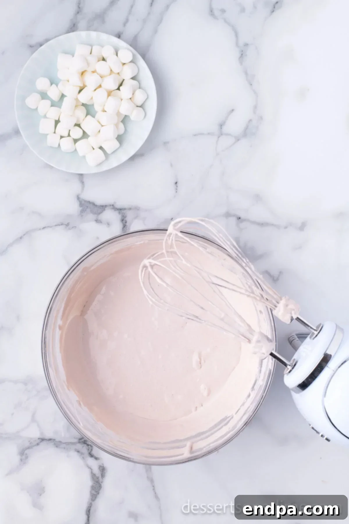 Decadent Hot Chocolate Dip 4 Using an electric hand mixer to blend the hot chocolate dip ingredients until the mixture is smooth and creamy.