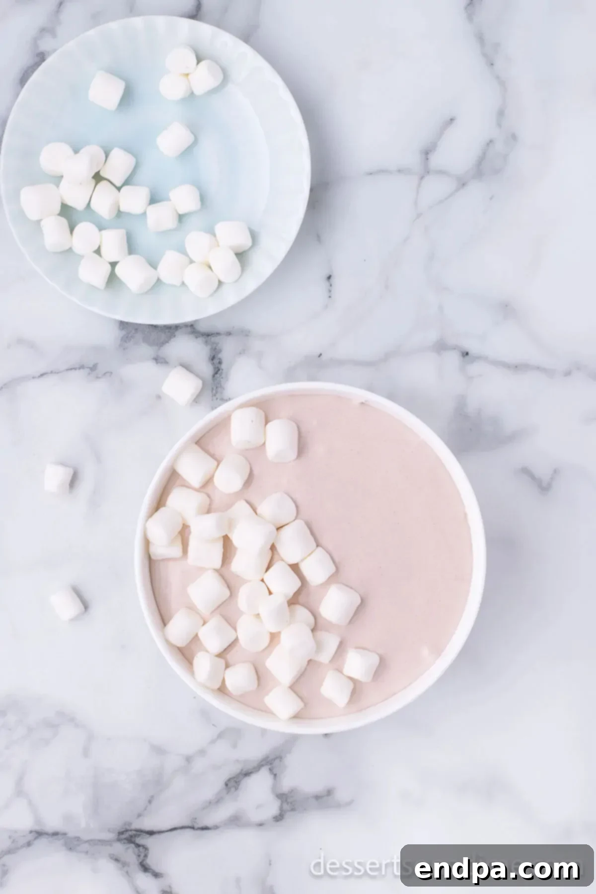 Decadent Hot Chocolate Dip 5 Transferring the finished, creamy hot chocolate dip into a decorative serving bowl for presentation.