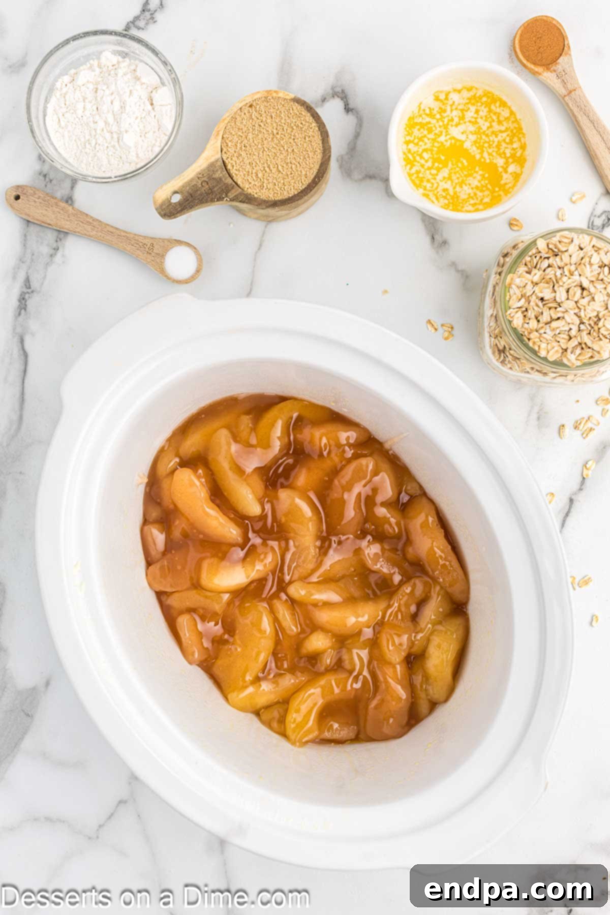 Cozy Slow Cooker Apple Crisp 4 Apple pie filling in crock pot.