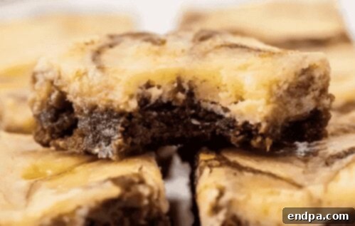 Slice of Easy Cheesecake Brownies.