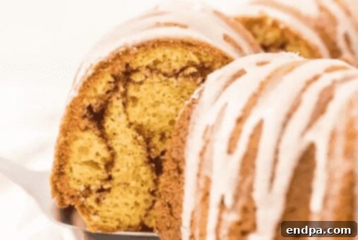 Slice of Cinnamon Bundt Cake with glaze.