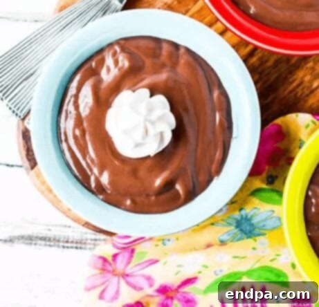 Homemade chocolate pudding in a glass jar.